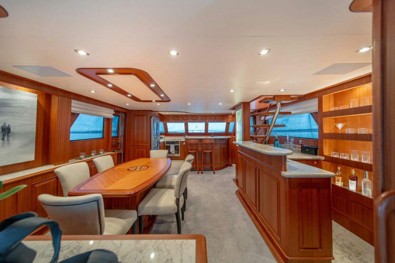 a room with a table chairs and a large window aboard ABRI SUR LA MER Yacht for Sale