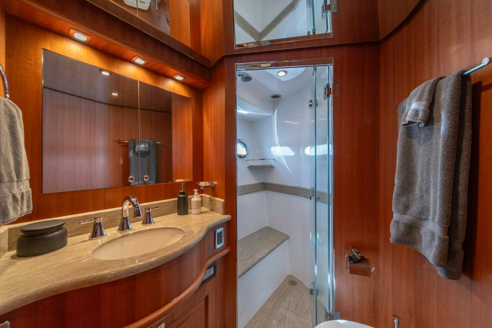 a bathroom with a sink and a shower aboard ABRI SUR LA MER Yacht for Sale