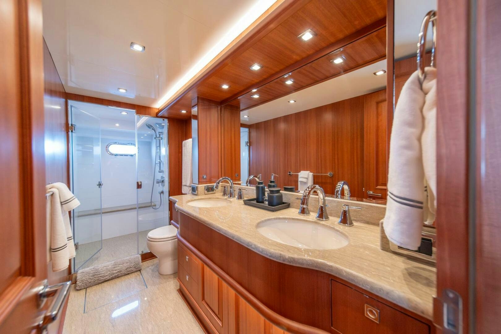 a bathroom with a large mirror aboard ABRI SUR LA MER Yacht for Sale