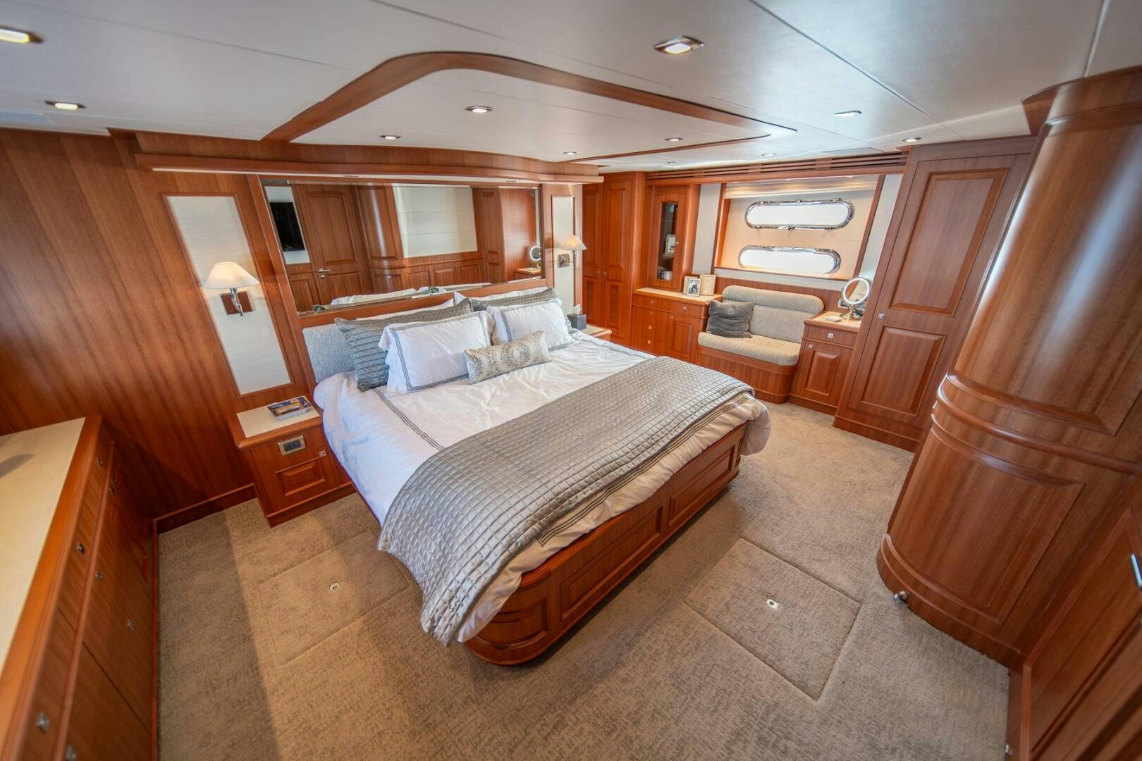 a bedroom with a bed and a wood wall aboard ABRI SUR LA MER Yacht for Sale
