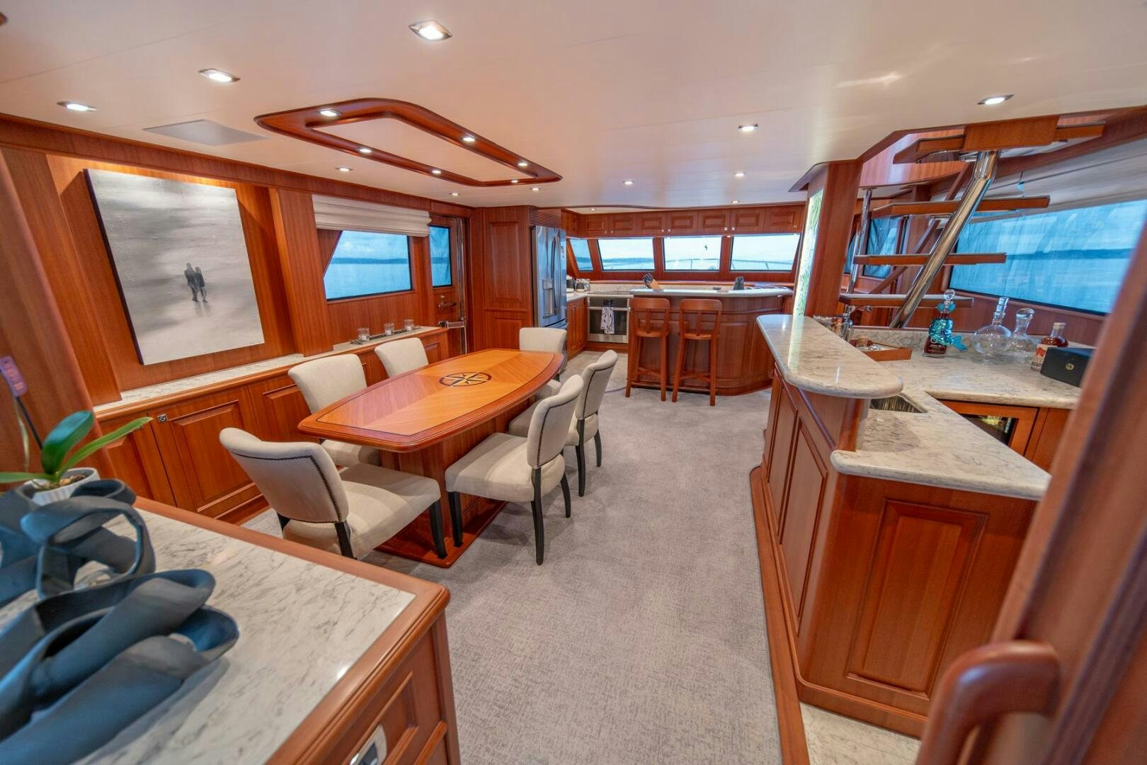 a room with a table chairs and a window aboard ABRI SUR LA MER Yacht for Sale