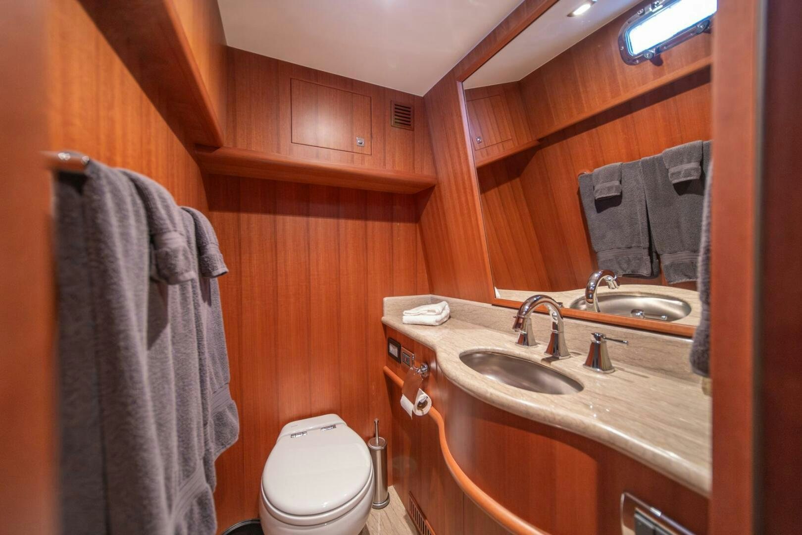 a bathroom with a sink and toilet aboard ABRI SUR LA MER Yacht for Sale