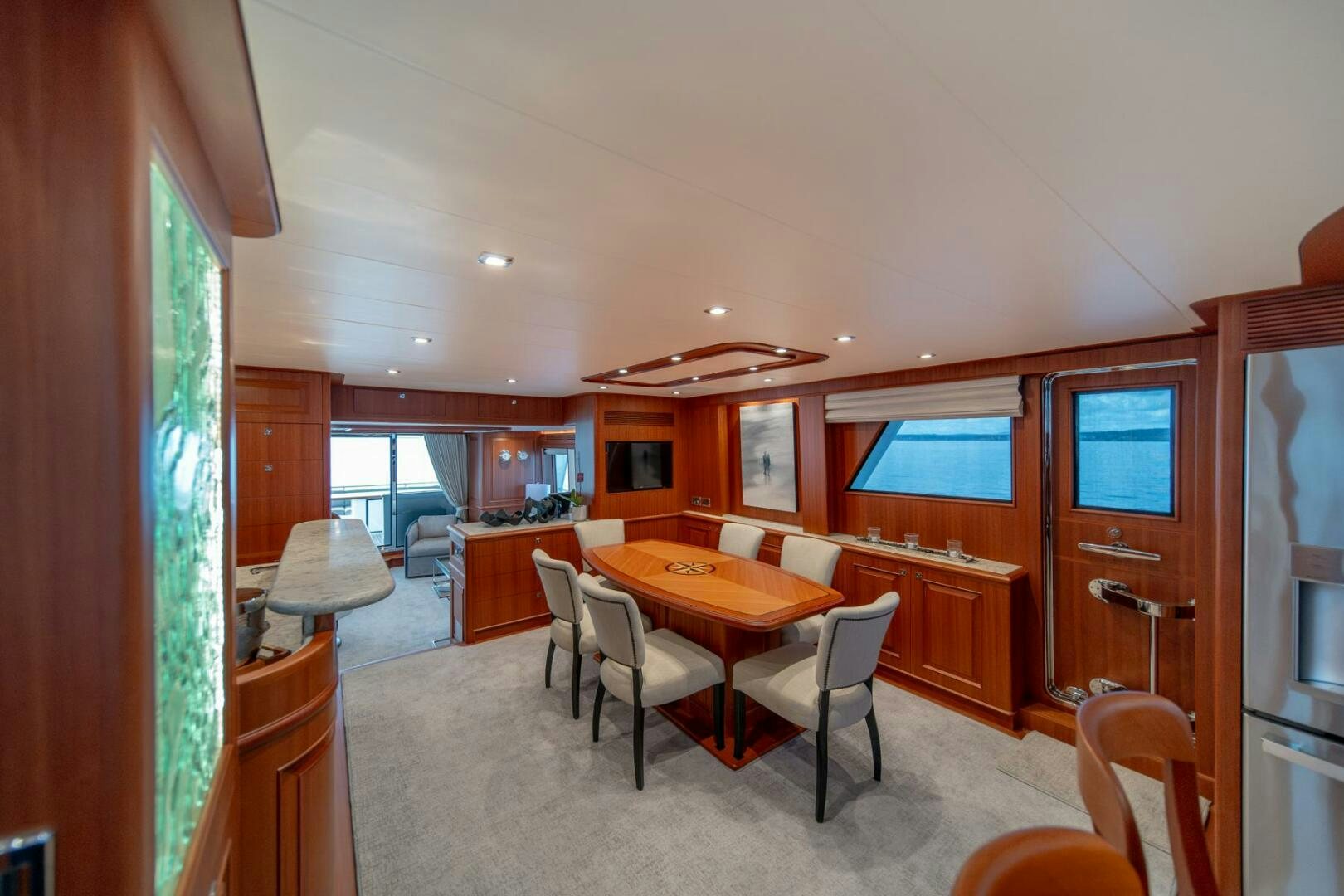 a dining room and kitchen aboard ABRI SUR LA MER Yacht for Sale