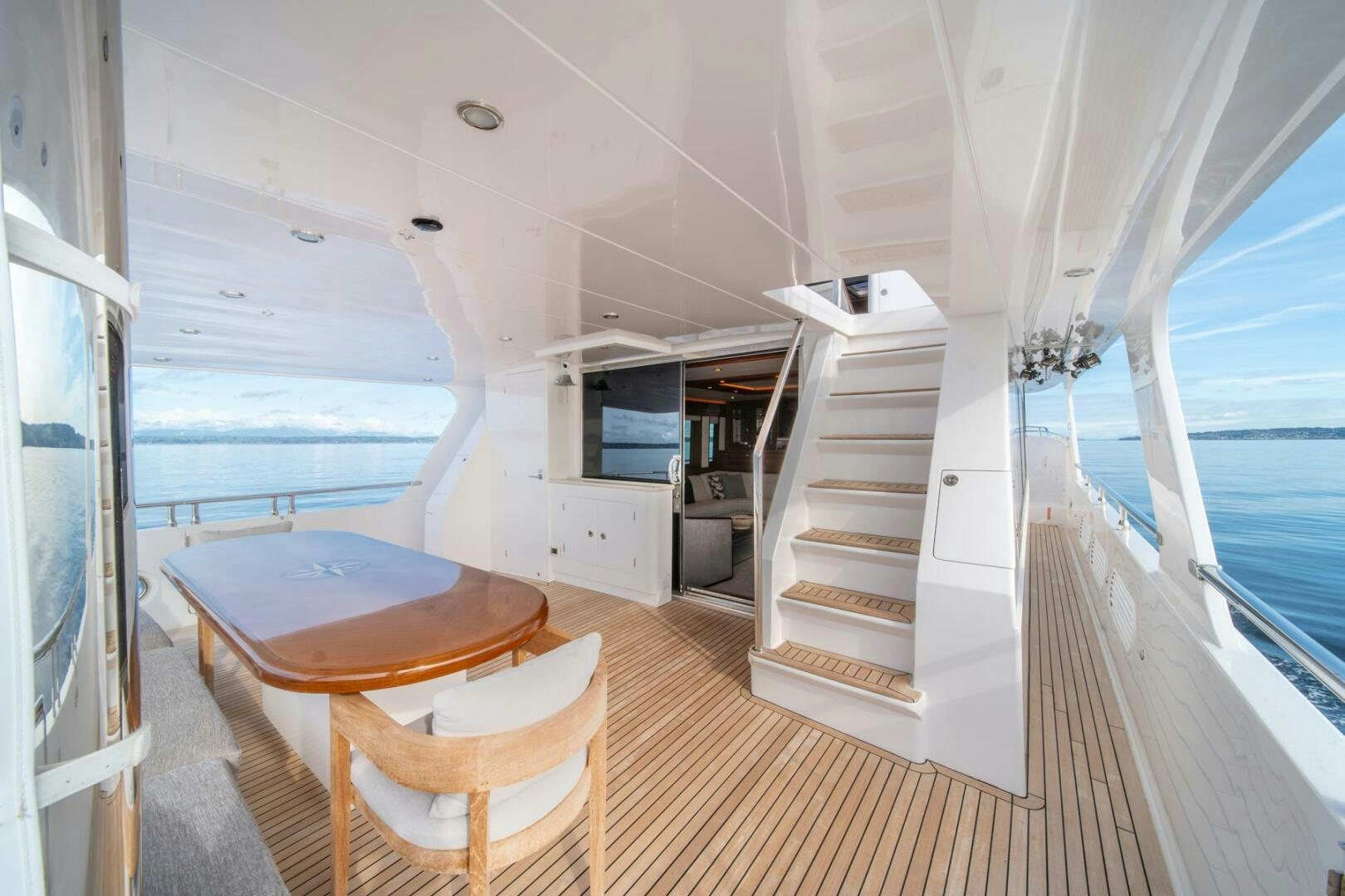 a room with a table and chairs aboard ABRI SUR LA MER Yacht for Sale