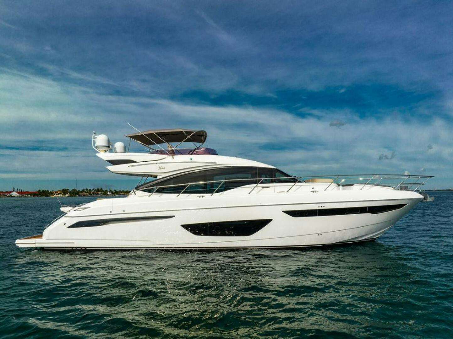 a white yacht in the water aboard NEVER SAY NEVER AGAIN Yacht for Sale