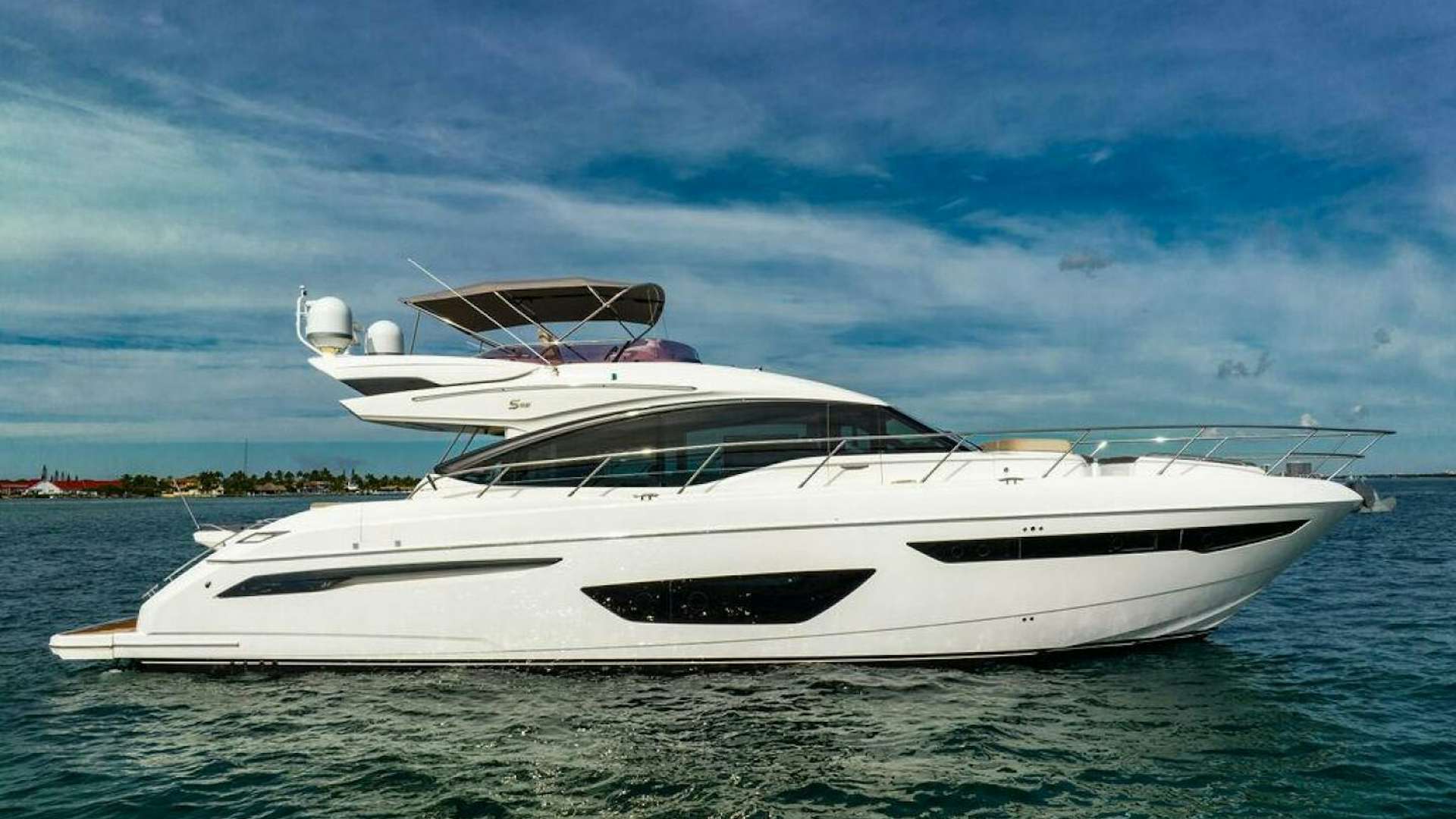 a white yacht in the water aboard NEVER SAY NEVER AGAIN Yacht for Sale