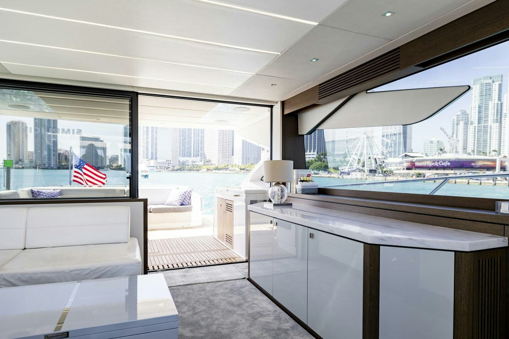 a room with a desk and a window with a flag aboard H Yacht for Sale