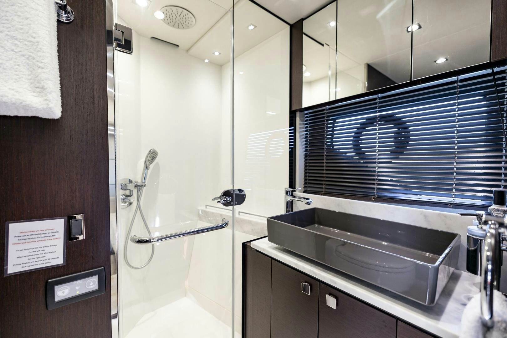 a bathroom with a sink and a mirror aboard H Yacht for Sale
