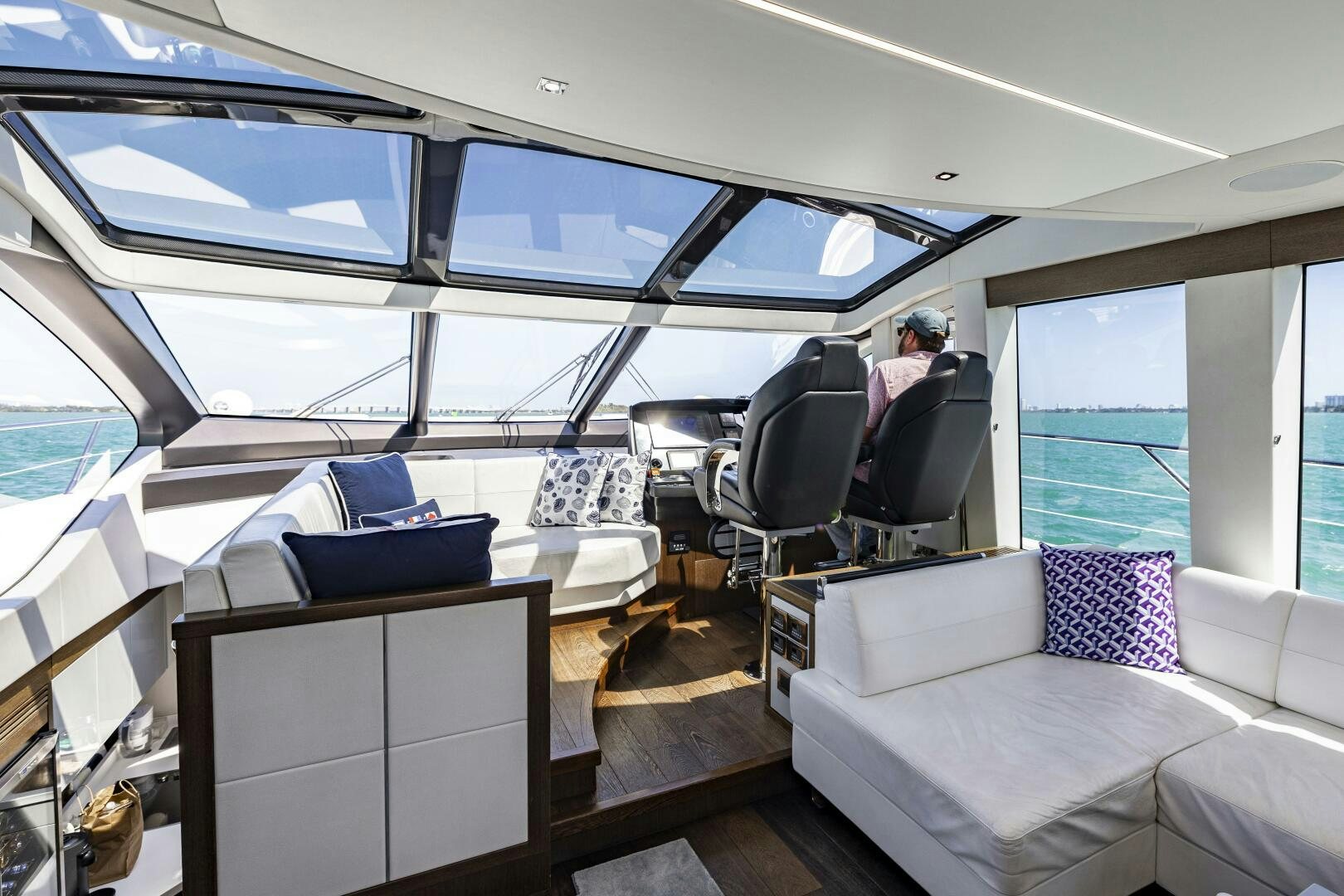 a person sitting in a vehicle aboard H Yacht for Sale