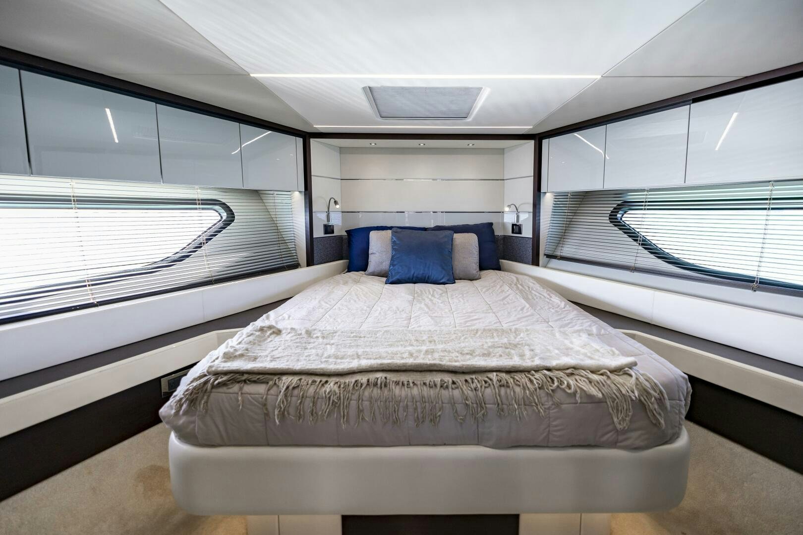 a room with a bed and a window aboard H Yacht for Sale