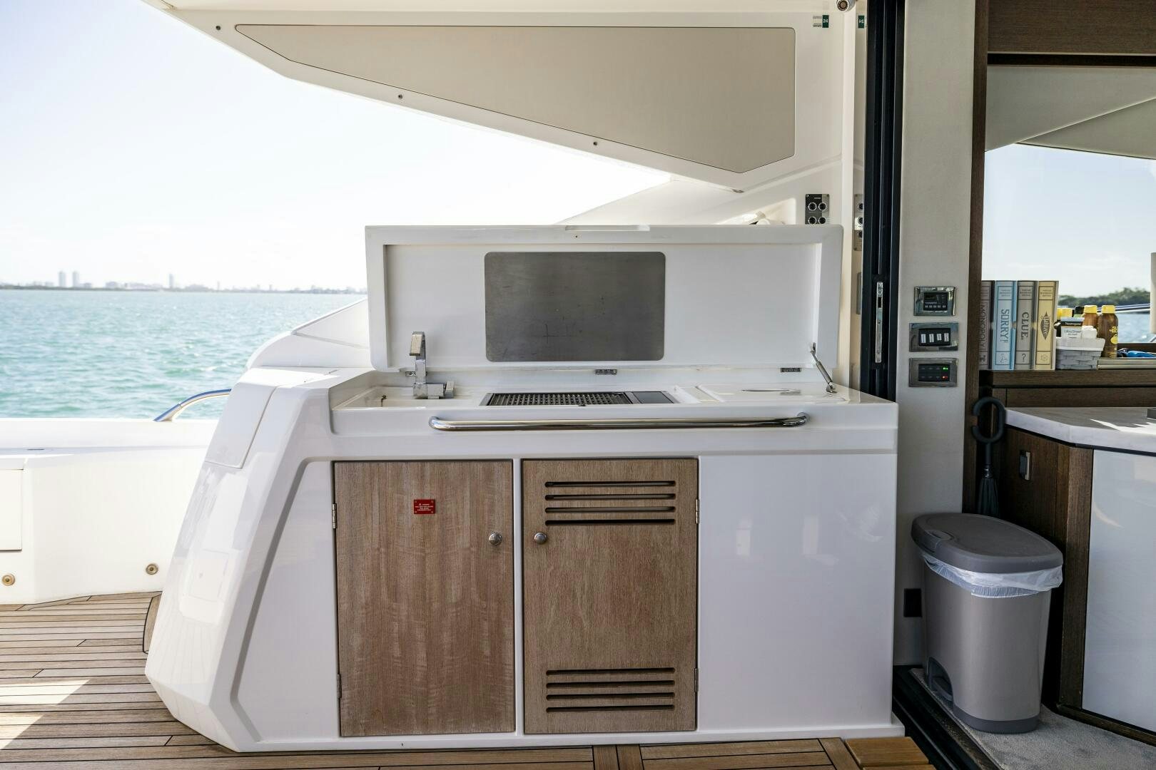 a kitchen with a sink and microwave aboard H Yacht for Sale