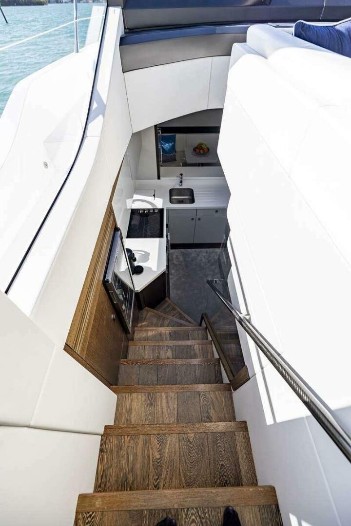 a staircase leading to a beach aboard H Yacht for Sale