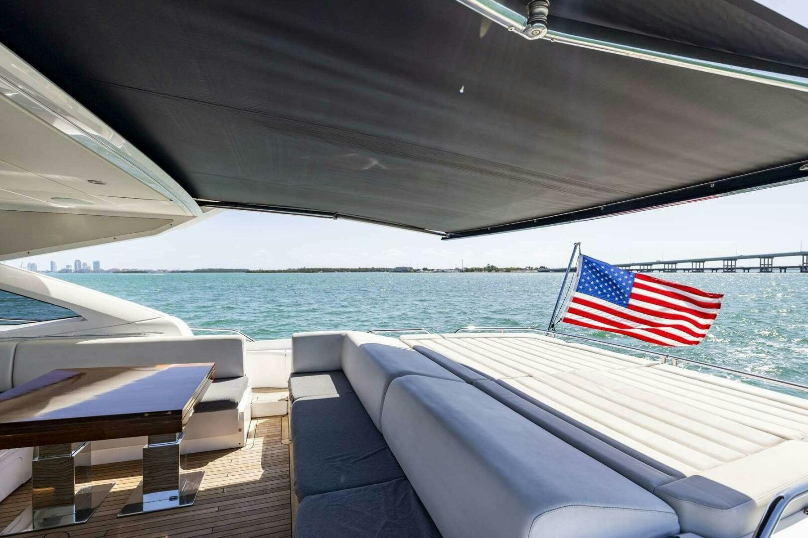 a boat with a flag on it aboard H Yacht for Sale