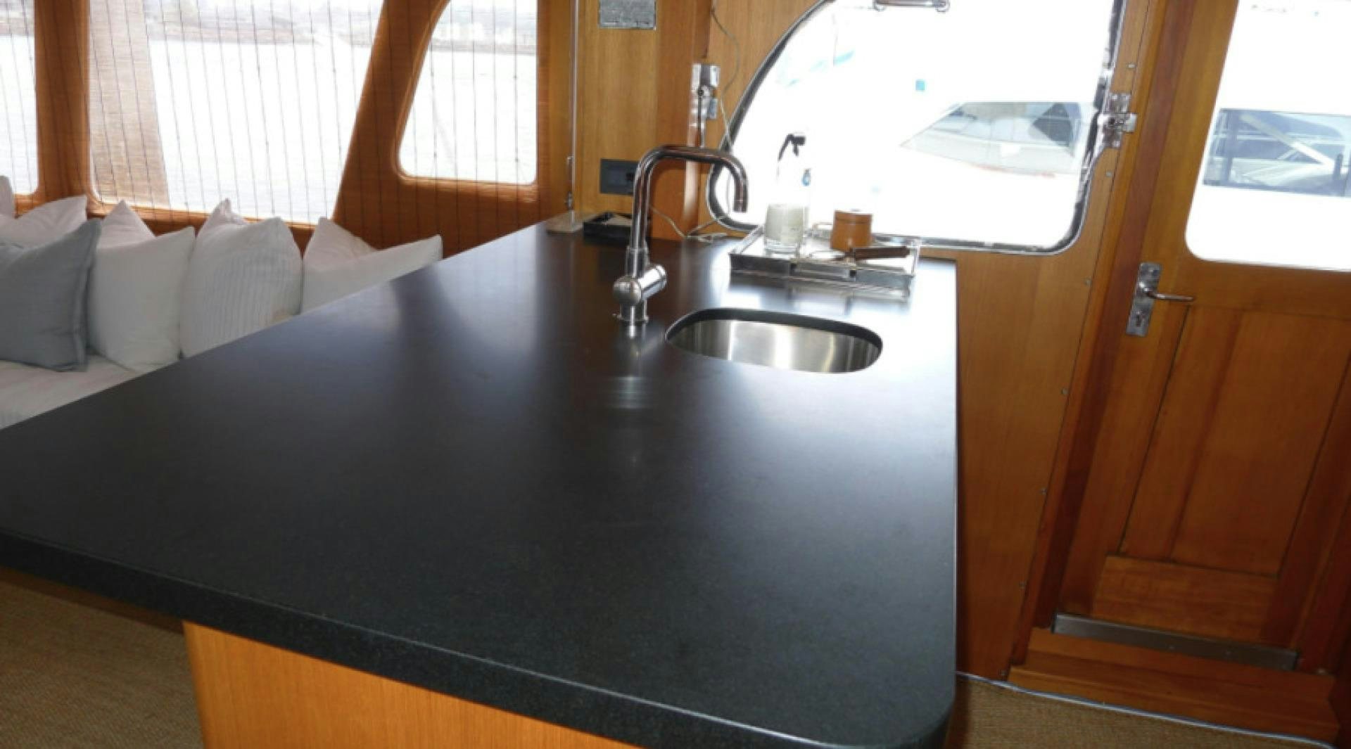 a black kitchen sink aboard DAKOTA Yacht for Sale