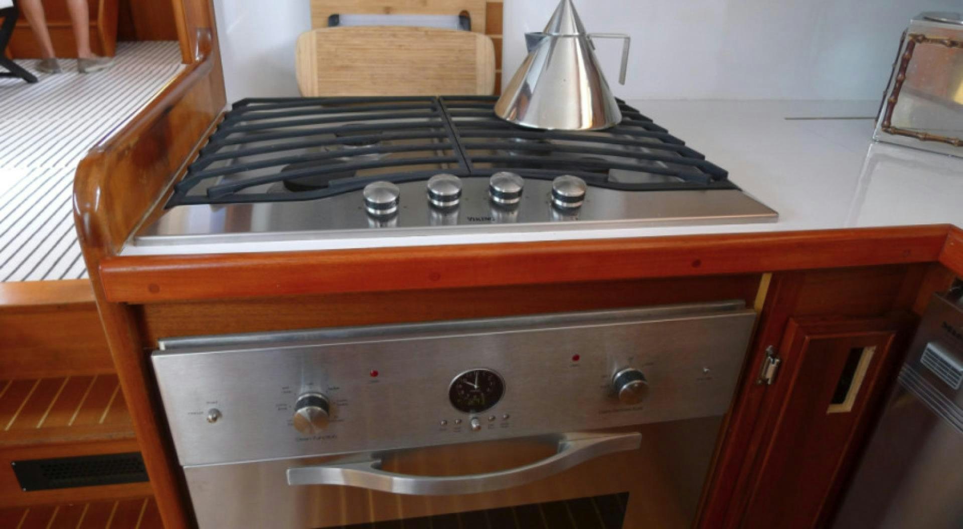 a stove with a kettle on top aboard DAKOTA Yacht for Sale