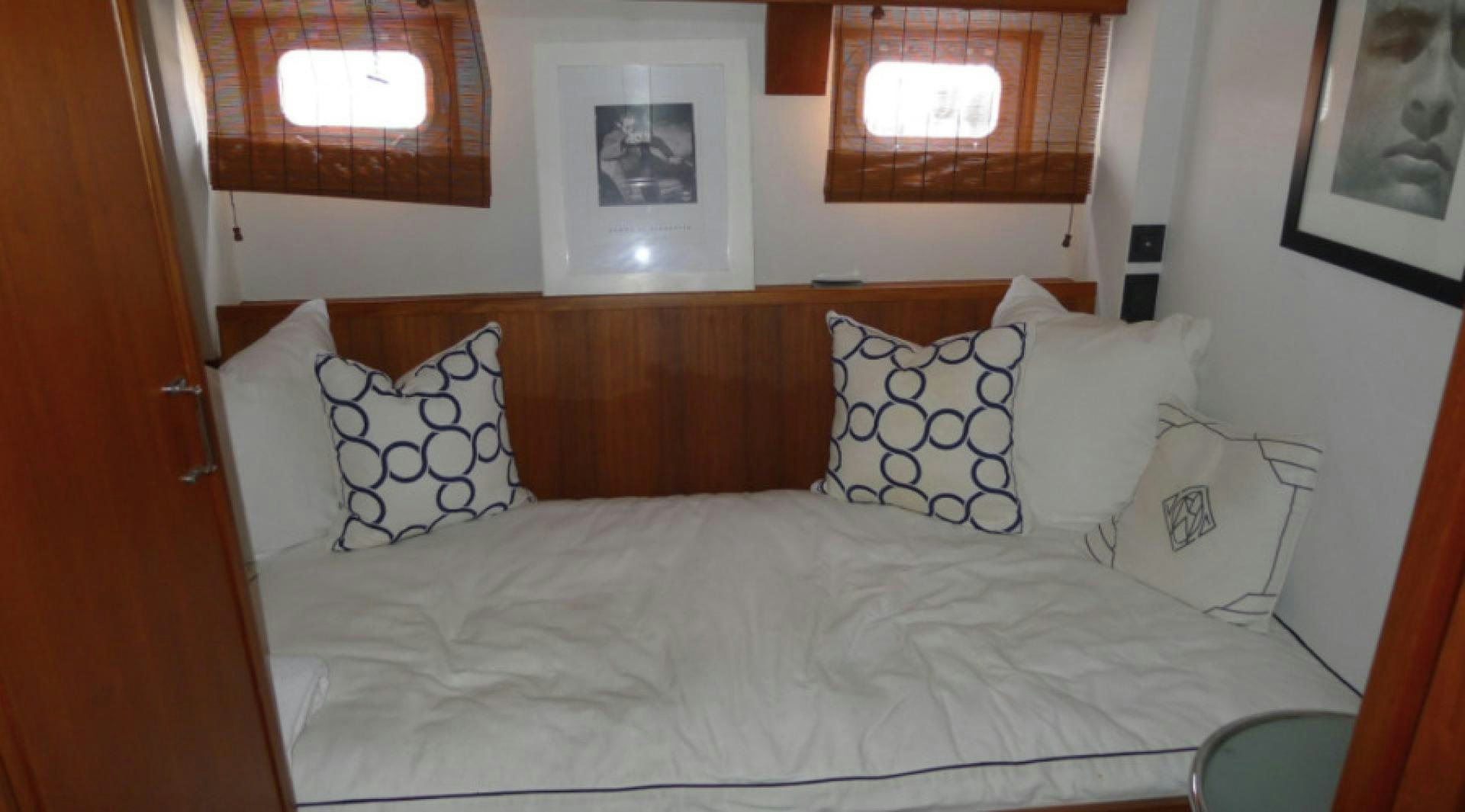 a bed with pillows aboard DAKOTA Yacht for Sale