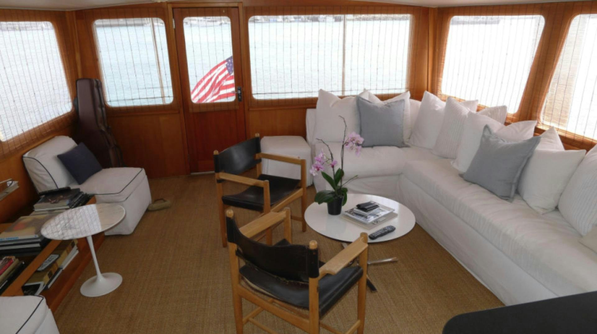 a living room with a couch and chairs aboard DAKOTA Yacht for Sale