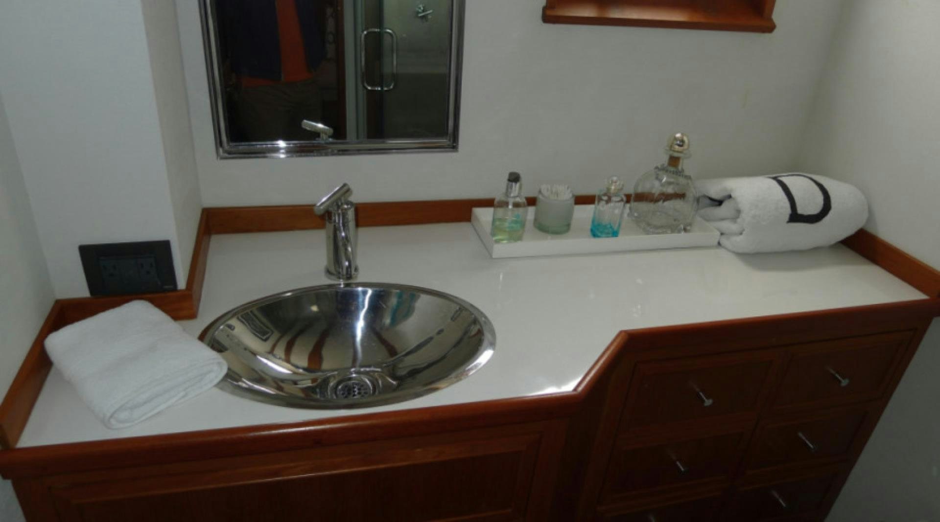 a bathroom sink with a mirror aboard DAKOTA Yacht for Sale