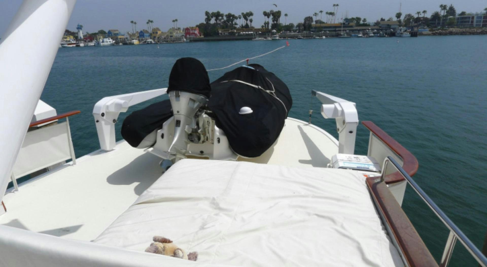 a boat with a black hat on it aboard DAKOTA Yacht for Sale