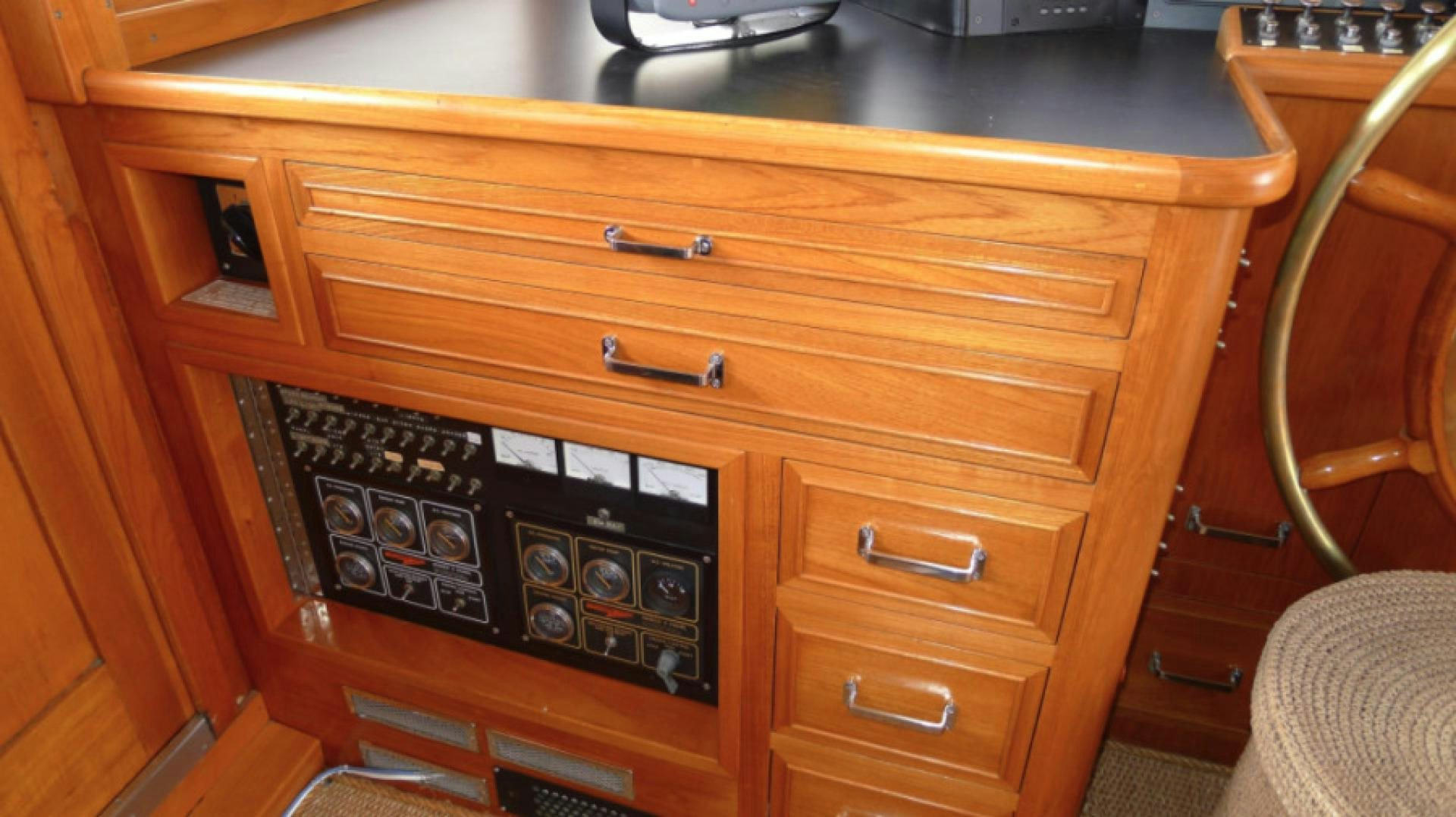 a wooden cabinet with drawers aboard DAKOTA Yacht for Sale
