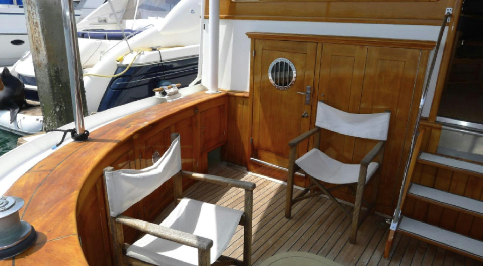 a couple of chairs on a boat aboard DAKOTA Yacht for Sale