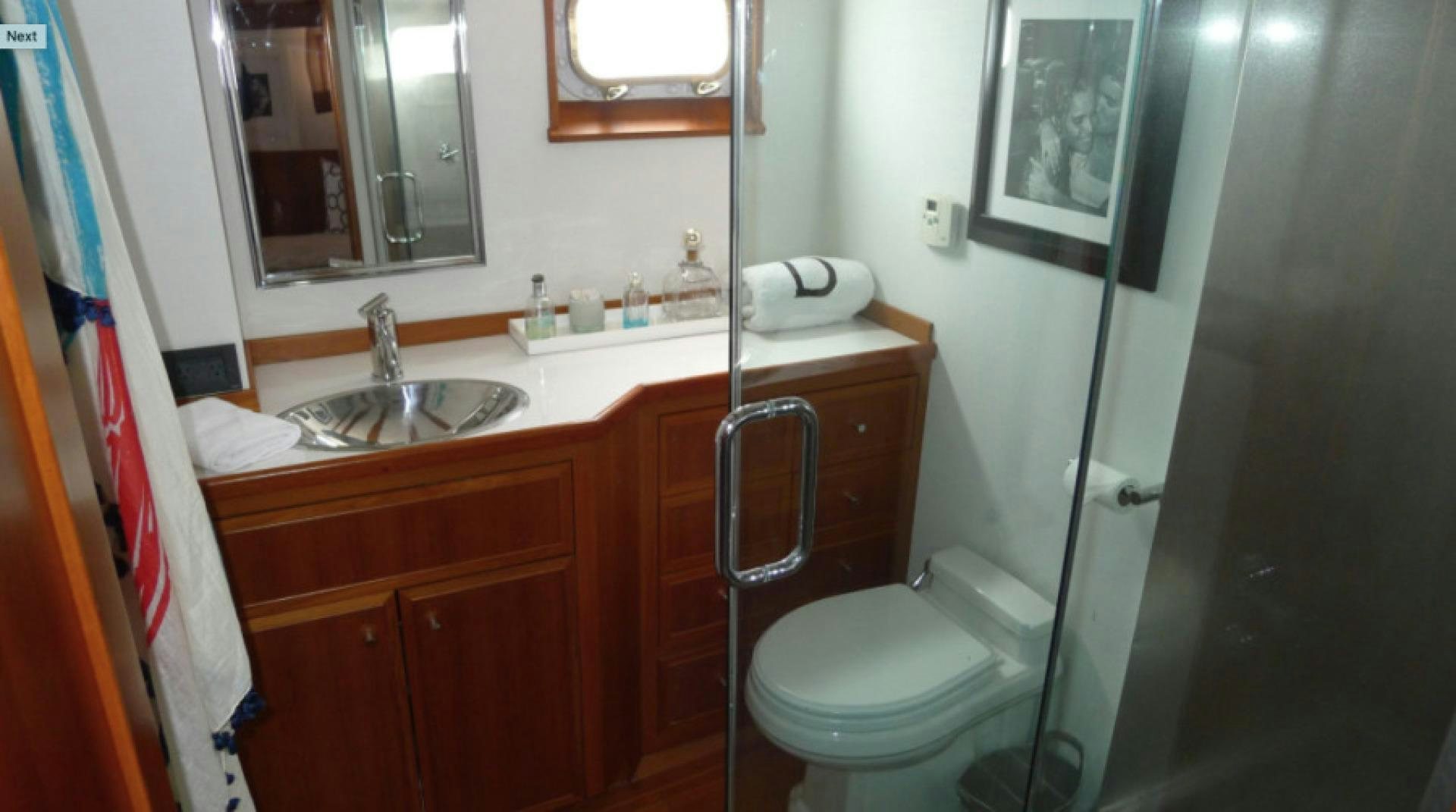 a bathroom with a sink and a toilet aboard DAKOTA Yacht for Sale