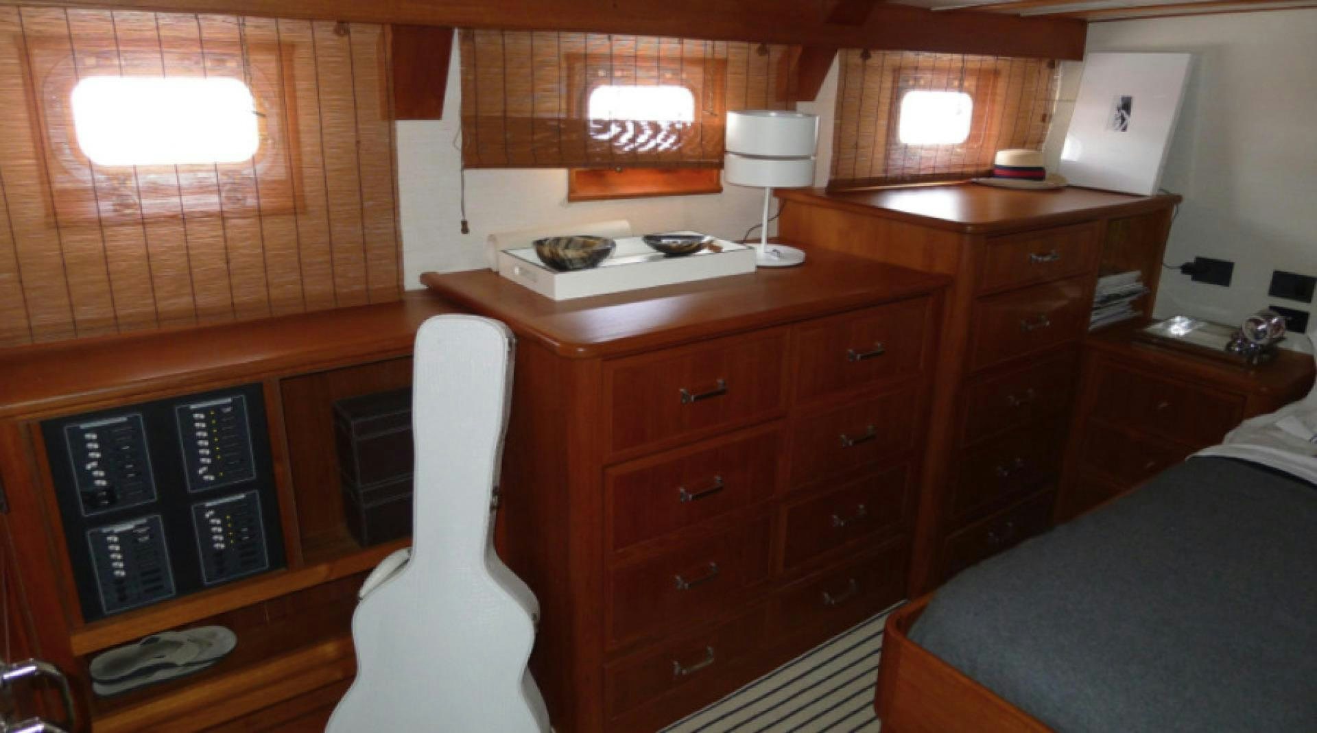 a room with a desk and a bed aboard DAKOTA Yacht for Sale