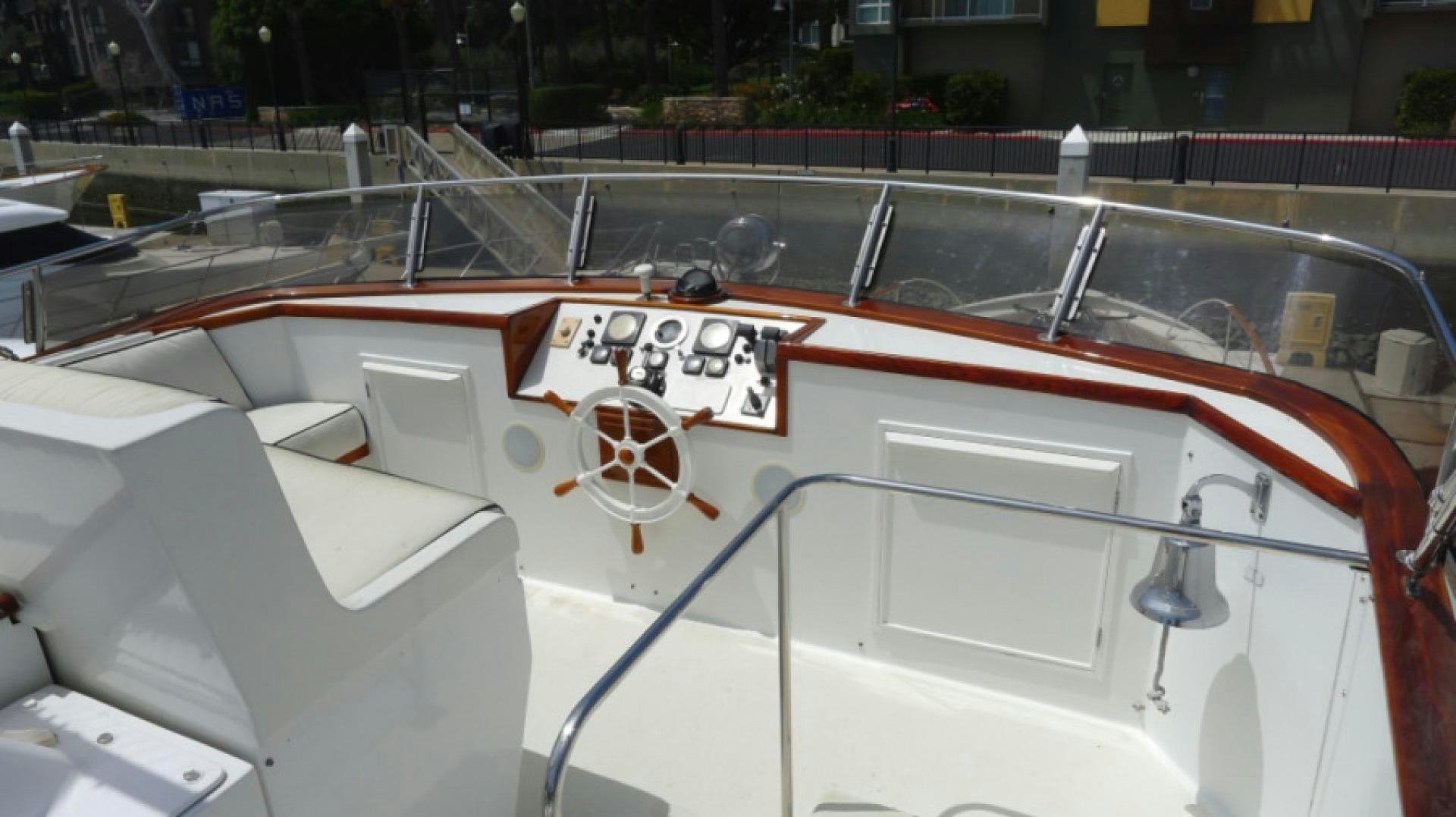 a boat with a sign on the front aboard DAKOTA Yacht for Sale