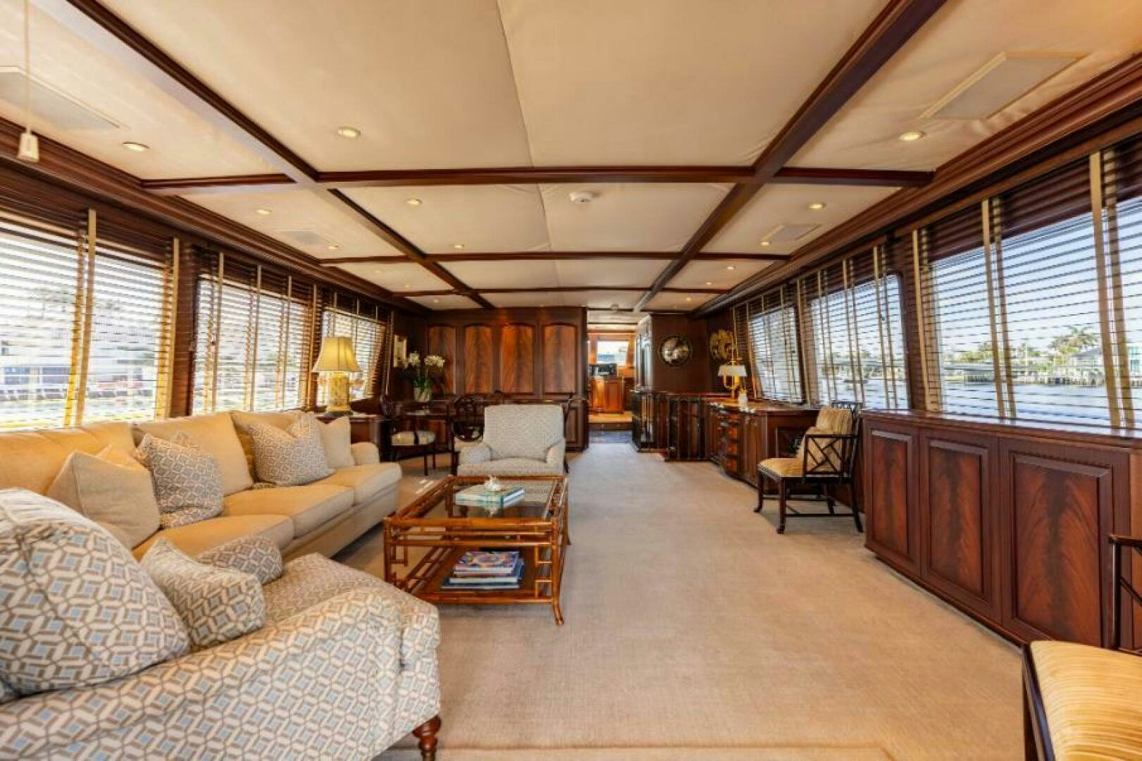 a living room with a large window aboard STARLIGHT Yacht for Sale