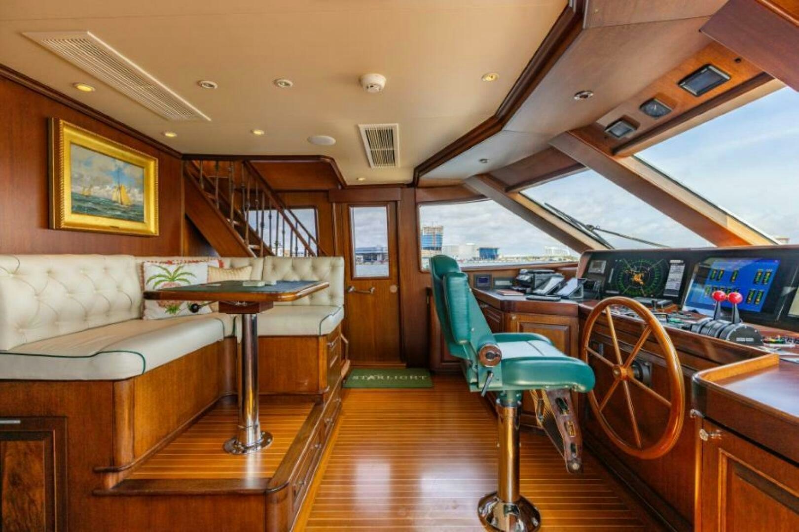 a room with a table and chairs aboard STARLIGHT Yacht for Sale