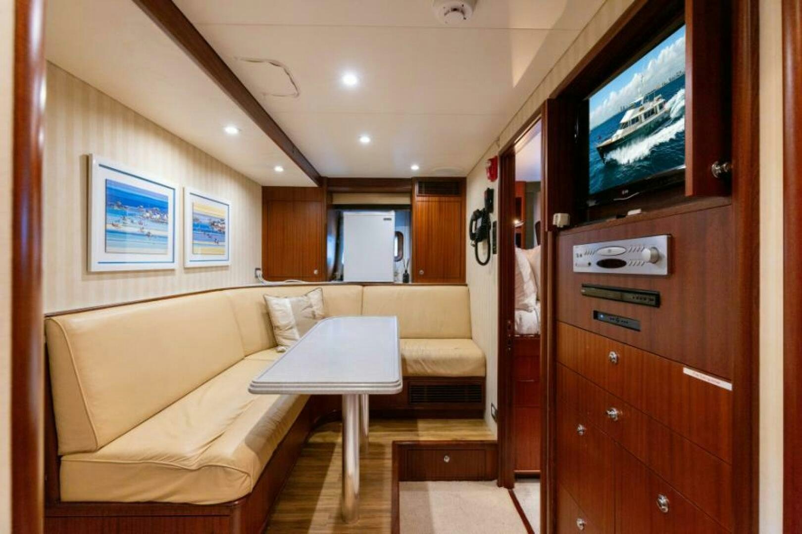 a living room with a couch and a television aboard STARLIGHT Yacht for Sale