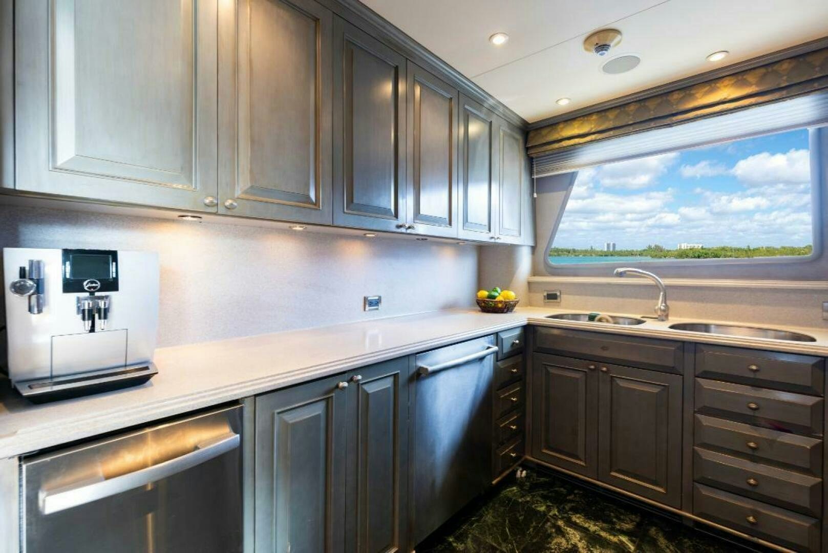 a kitchen with a large window aboard STARLIGHT Yacht for Sale