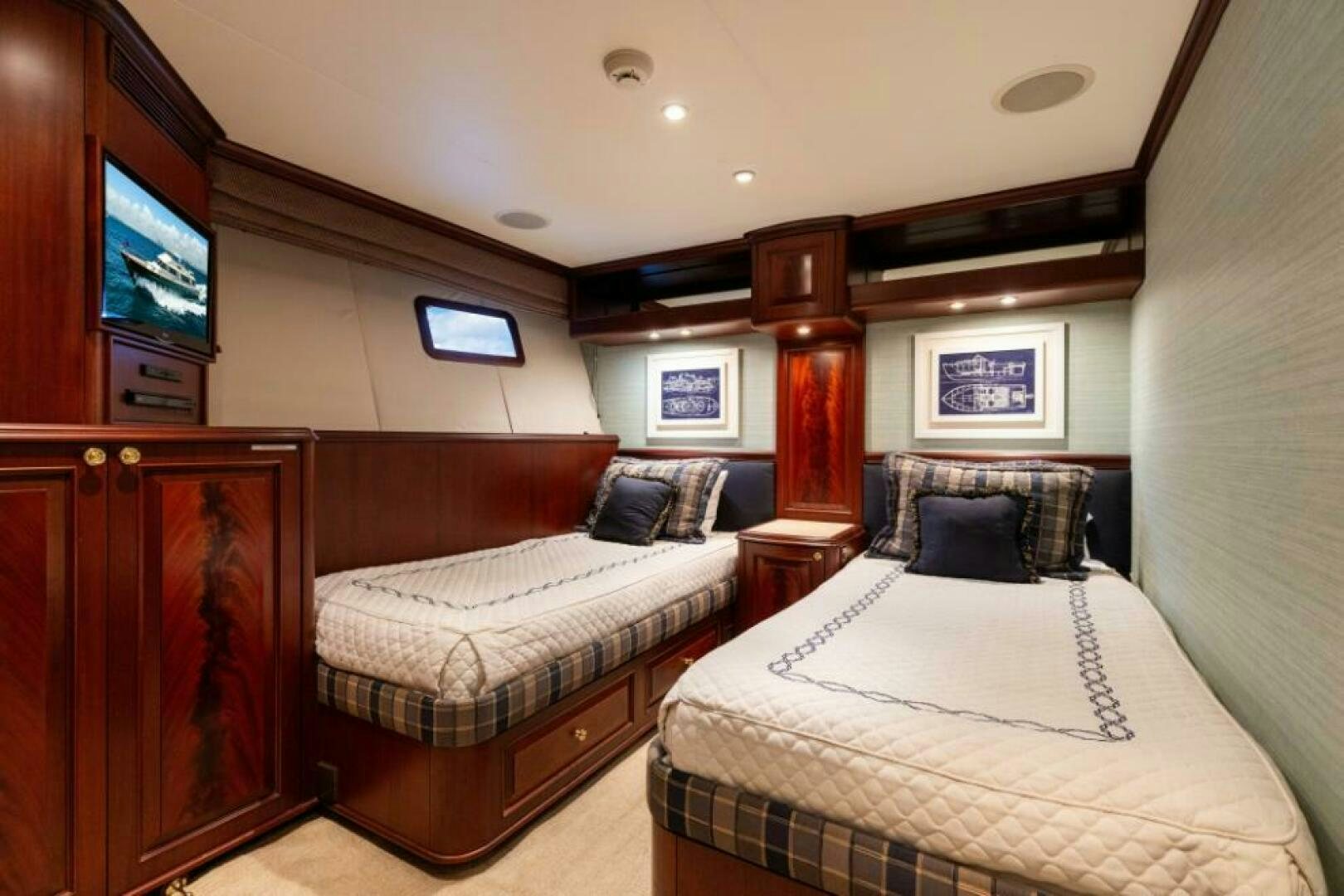 a couple of beds in a hotel room aboard STARLIGHT Yacht for Sale