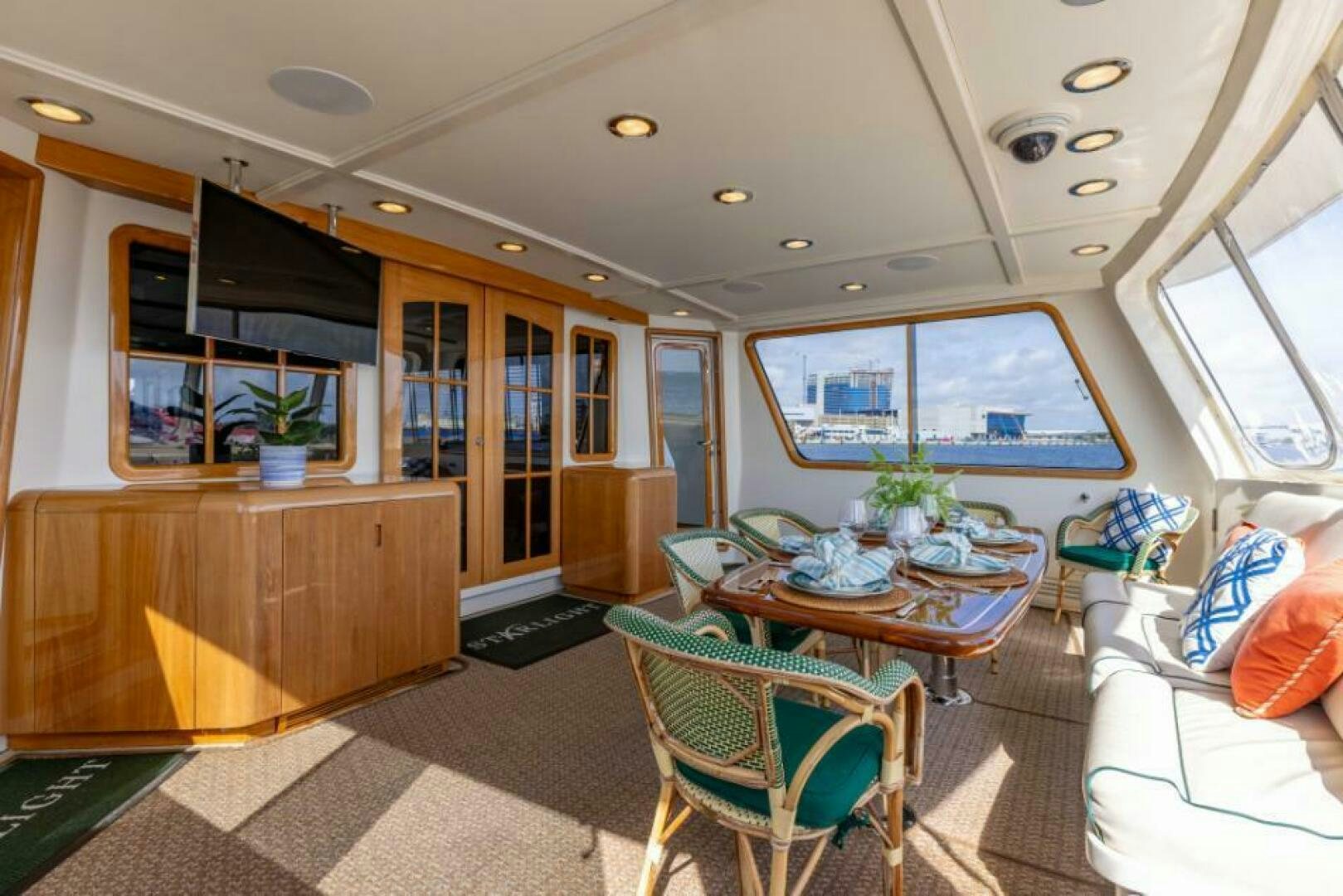 a living room with a table and chairs aboard STARLIGHT Yacht for Sale