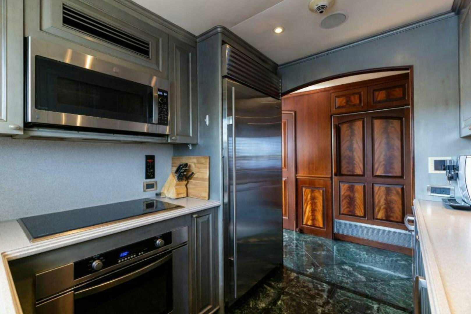 a kitchen with a microwave oven aboard STARLIGHT Yacht for Sale