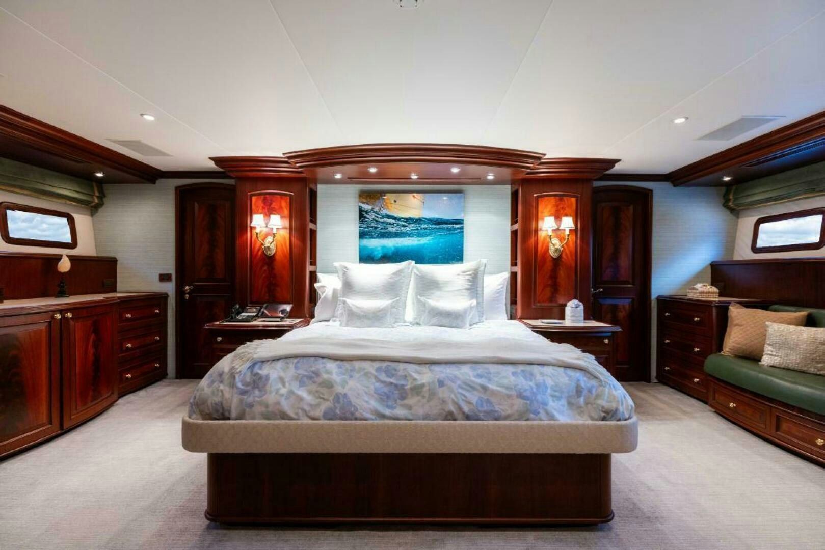 a bedroom with a bed and a couch aboard STARLIGHT Yacht for Sale
