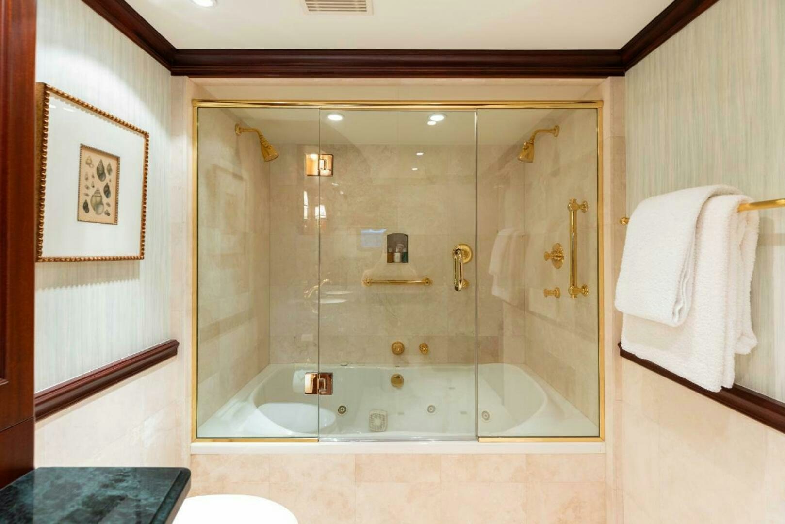 a bathroom with a glass shower aboard STARLIGHT Yacht for Sale