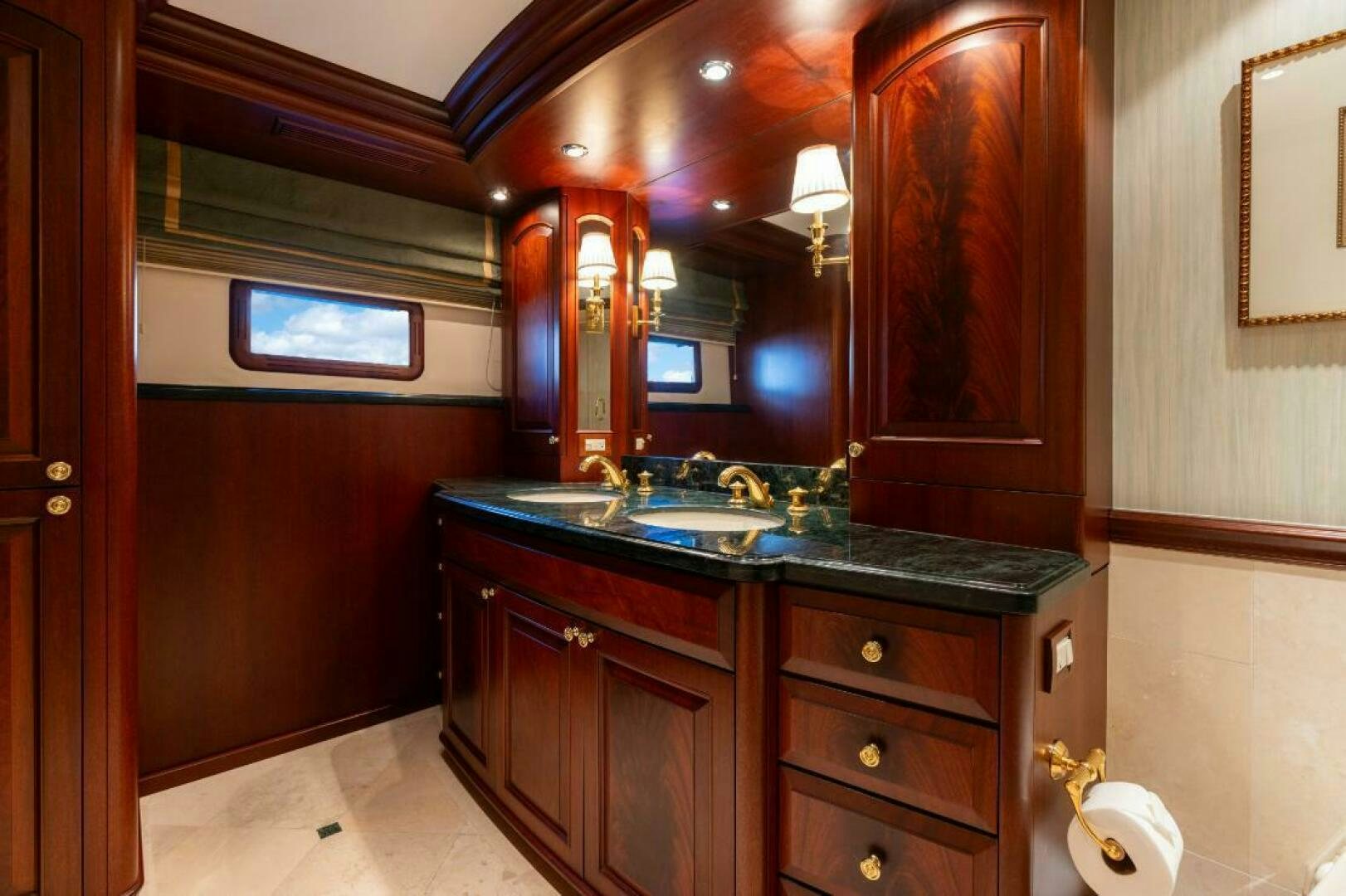 a bathroom with a large mirror aboard STARLIGHT Yacht for Sale