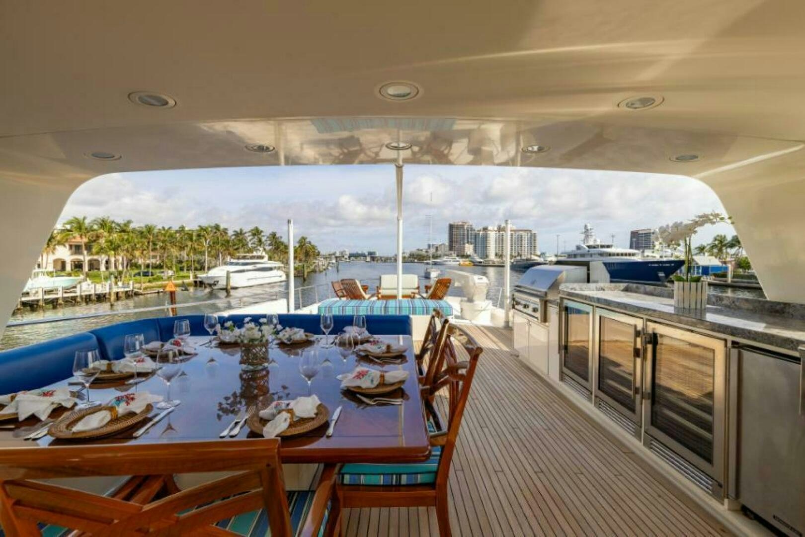 a large dining table on a balcony aboard STARLIGHT Yacht for Sale