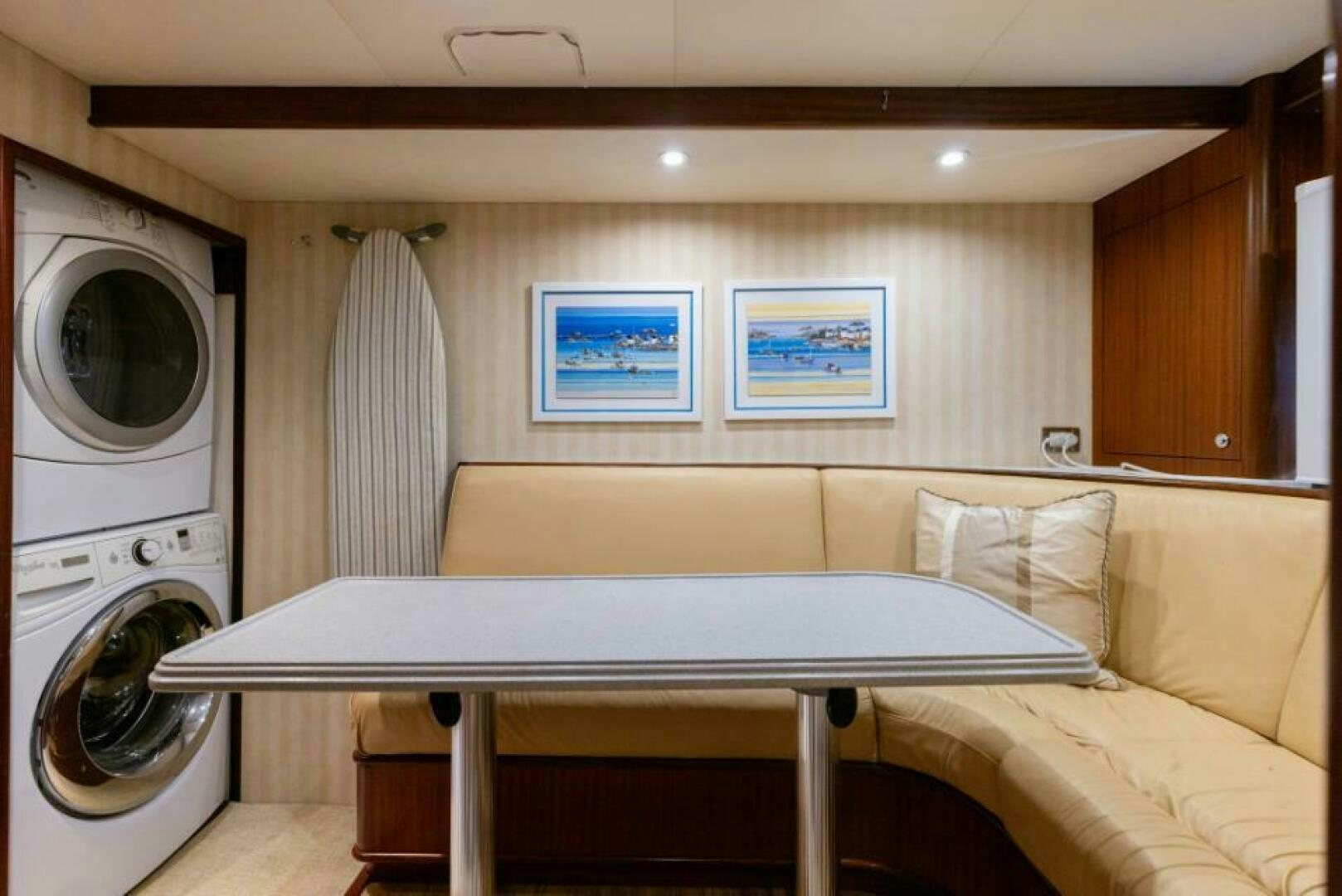 a room with a bed and a washing machine aboard STARLIGHT Yacht for Sale