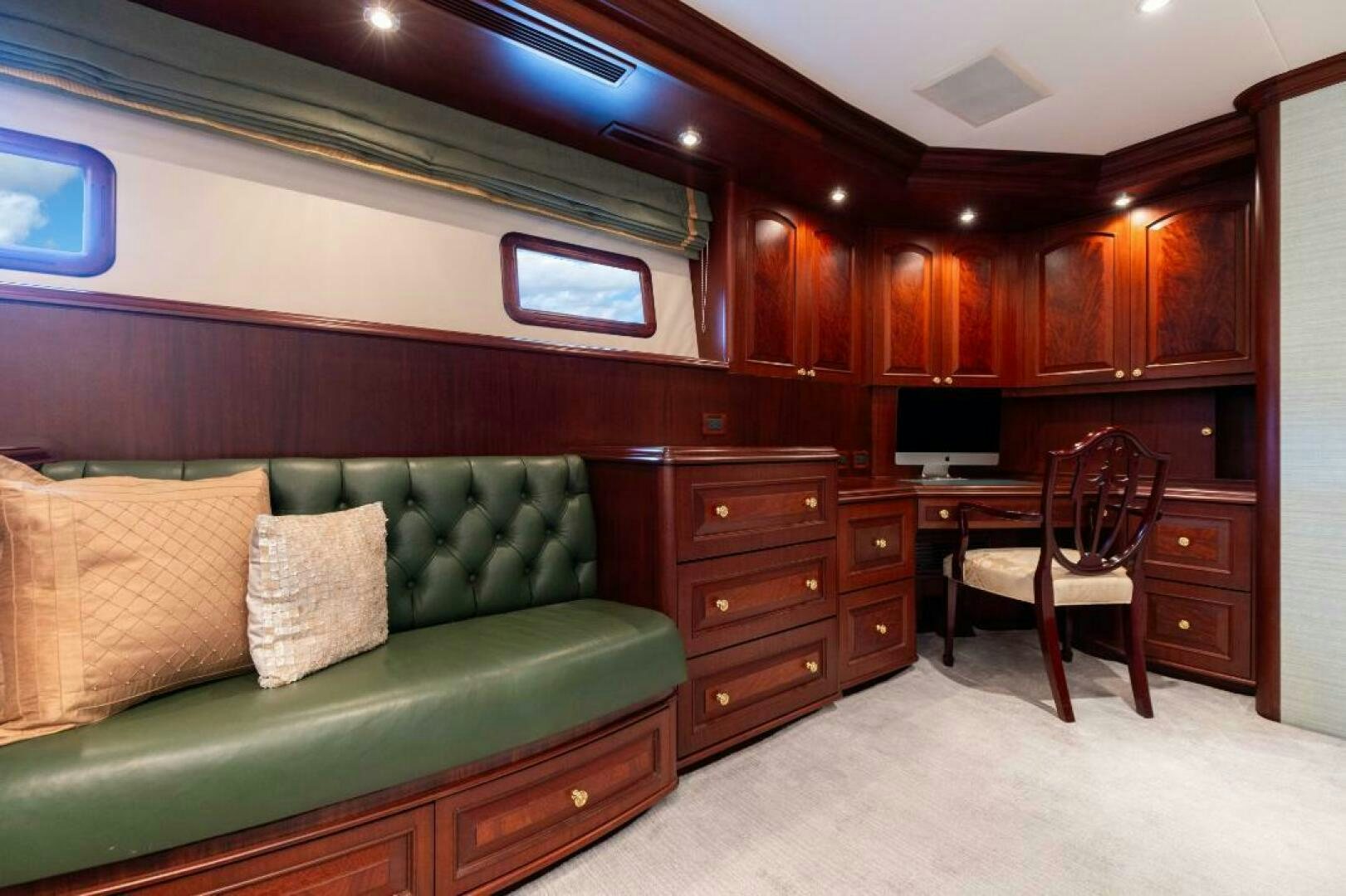 a living room with a couch and a table aboard STARLIGHT Yacht for Sale