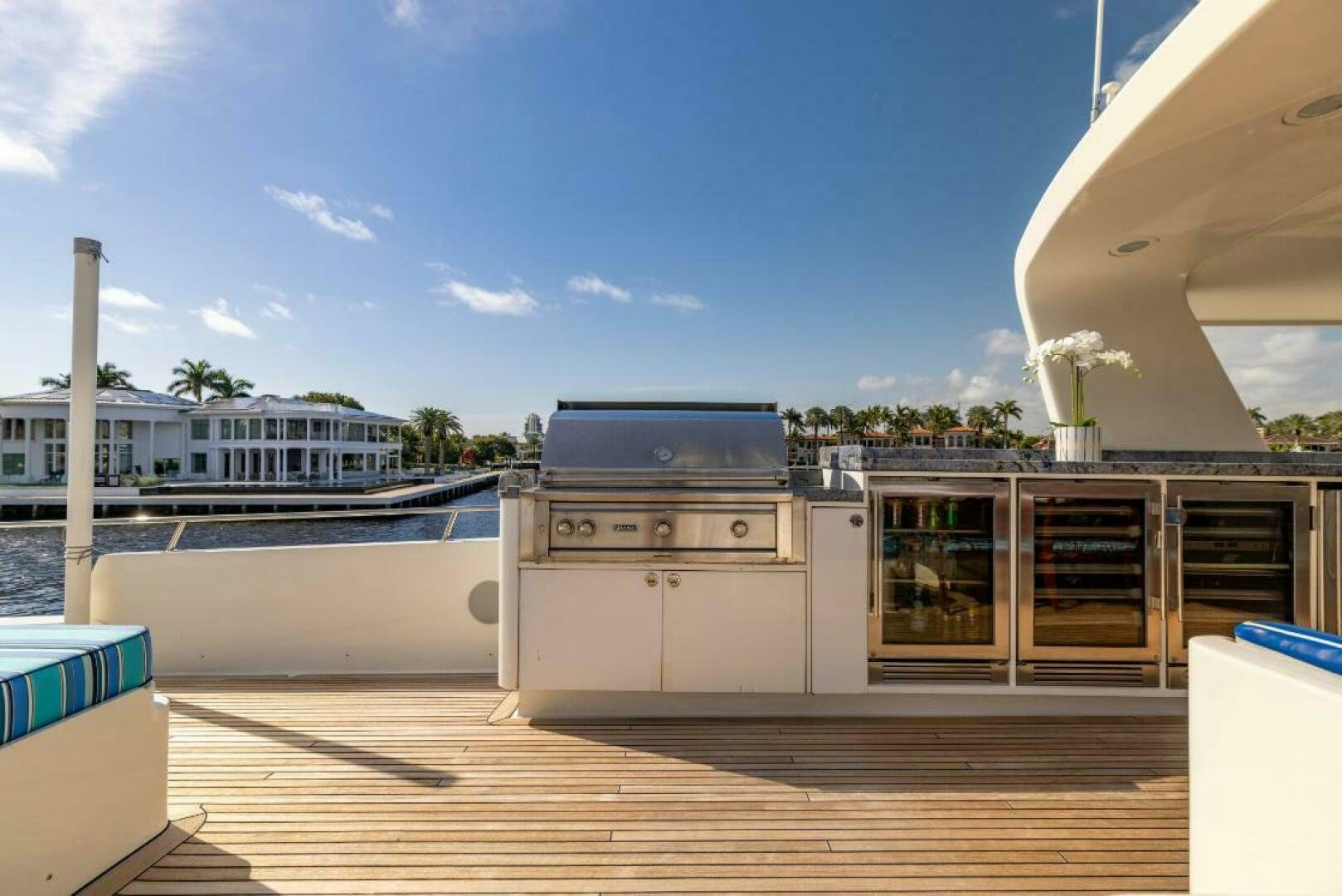 a deck with a large grill and a pool aboard STARLIGHT Yacht for Sale