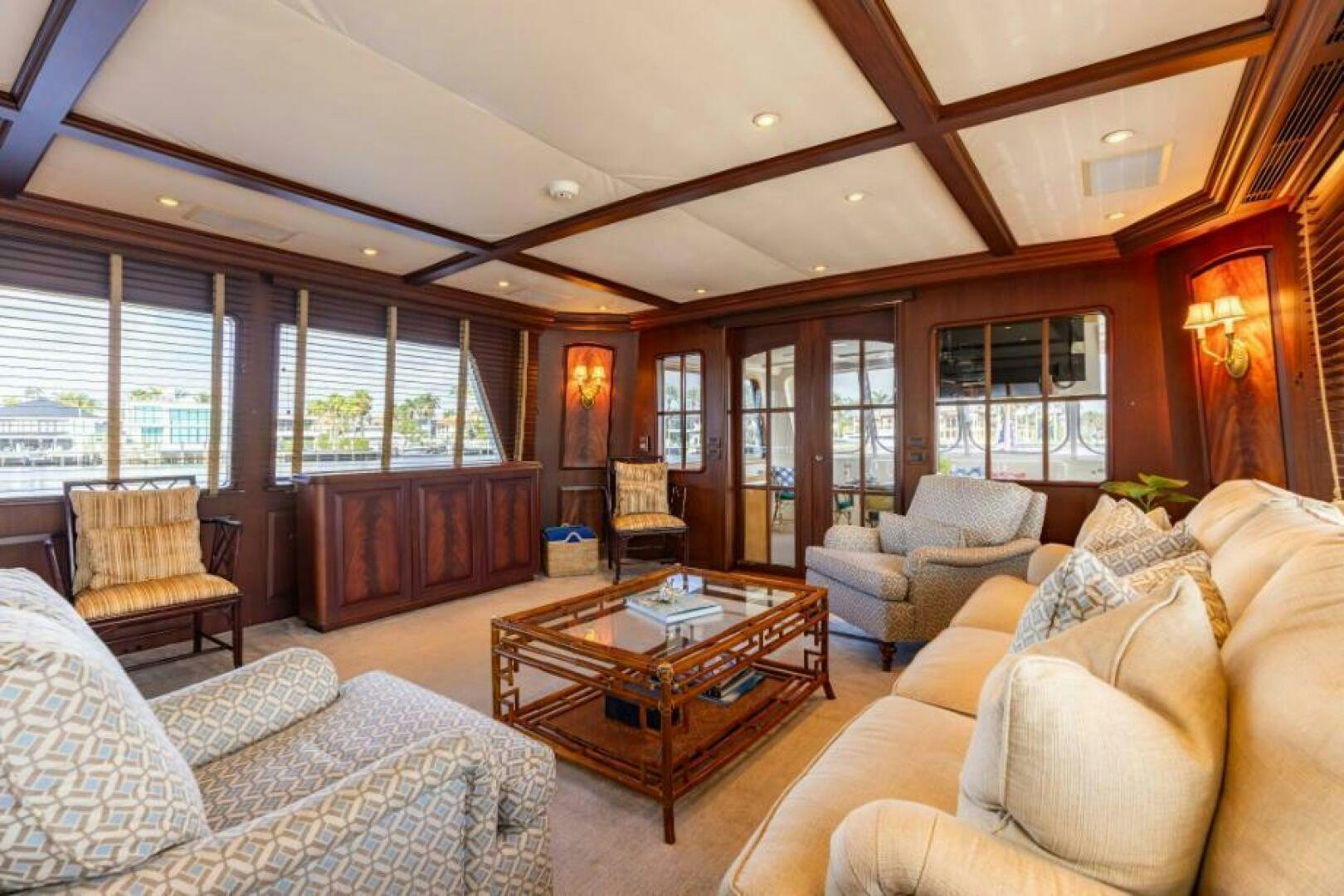 a living room with a large window aboard STARLIGHT Yacht for Sale