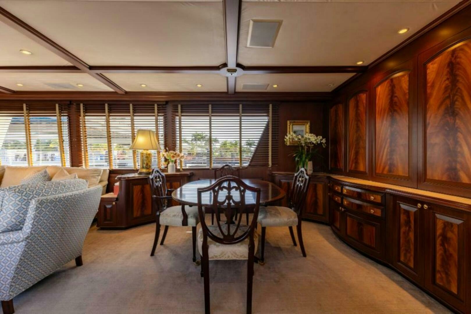 a living room with a couch and a table aboard STARLIGHT Yacht for Sale