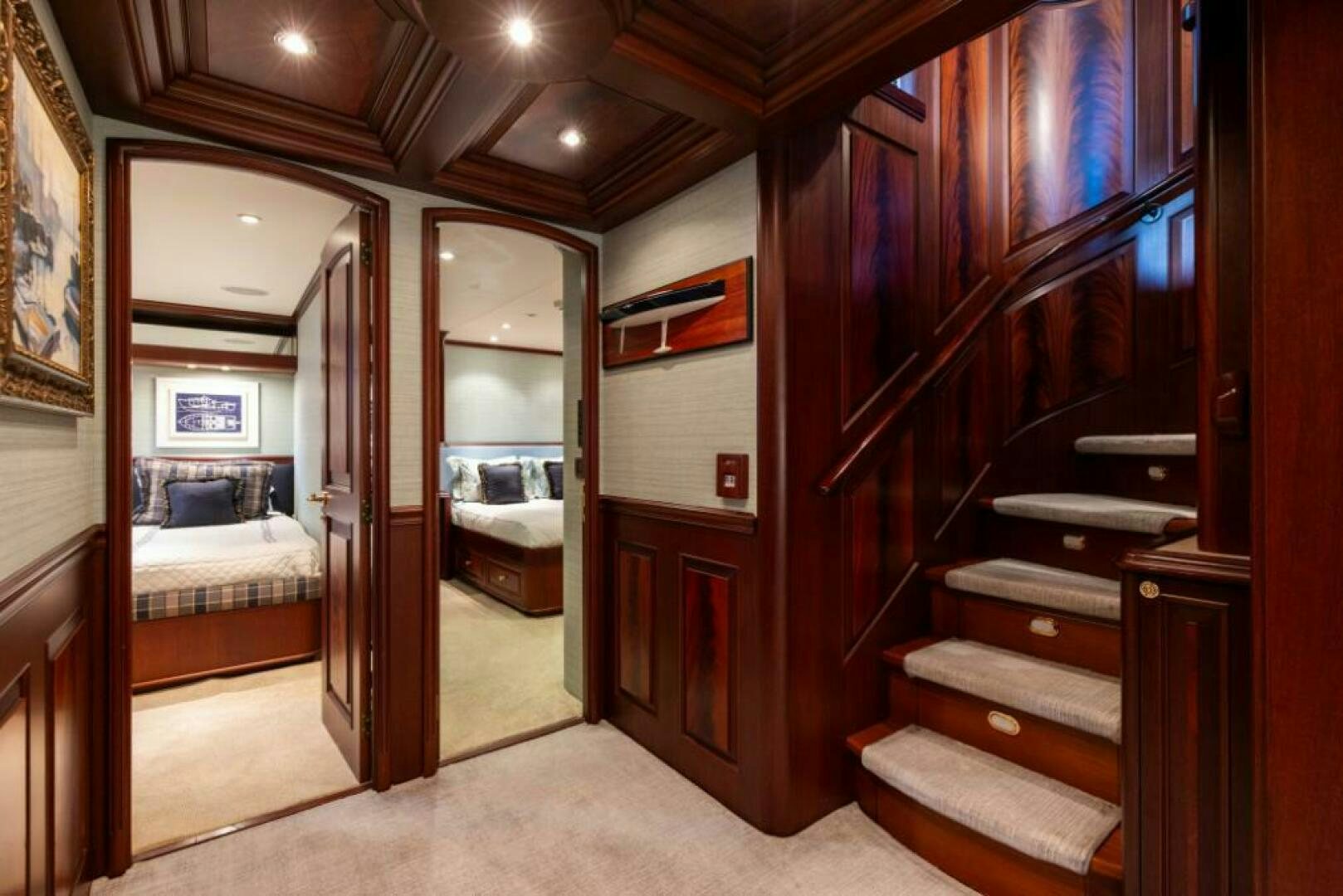 a bedroom with a bed and a mirror aboard STARLIGHT Yacht for Sale