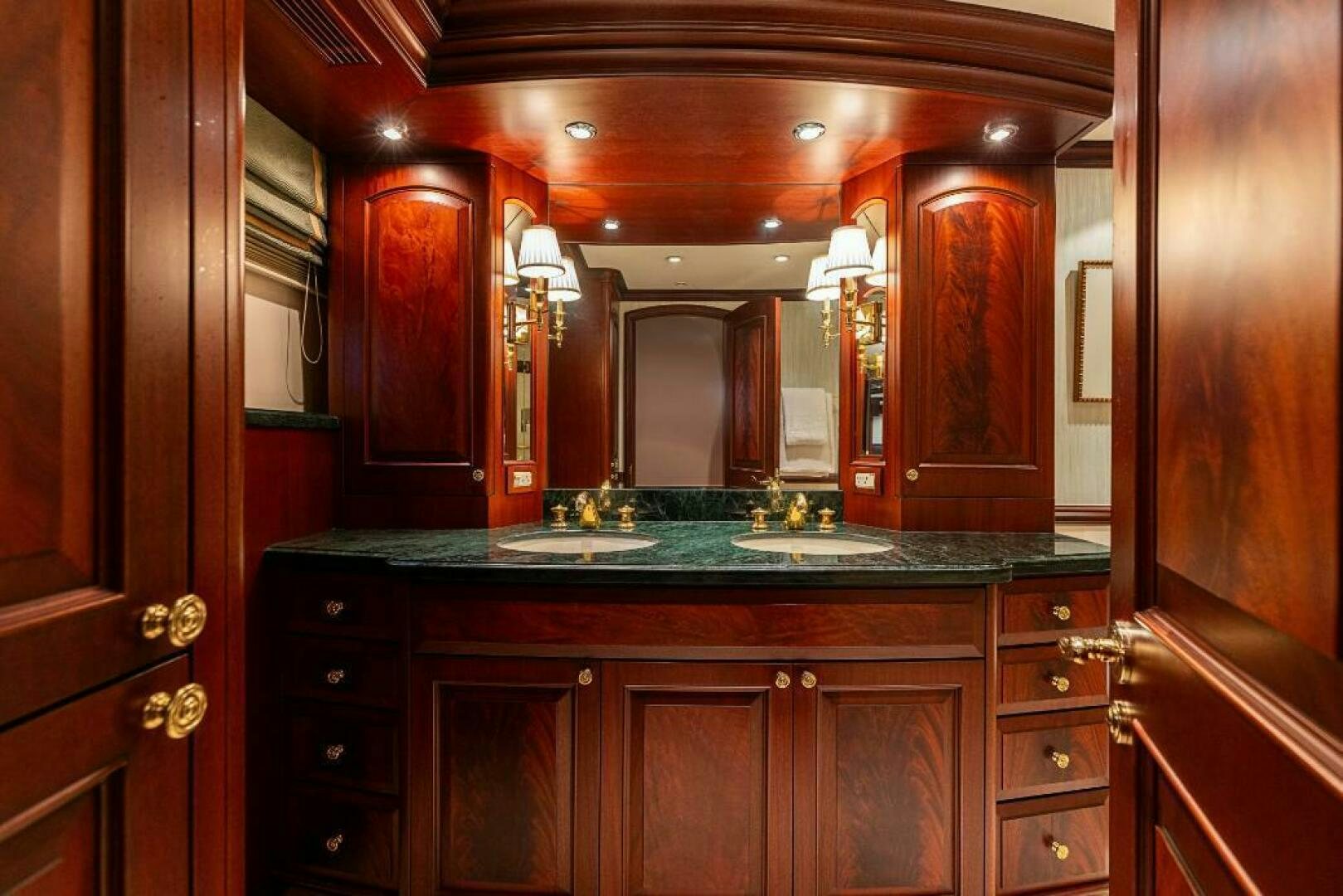 a bathroom with a large mirror aboard STARLIGHT Yacht for Sale