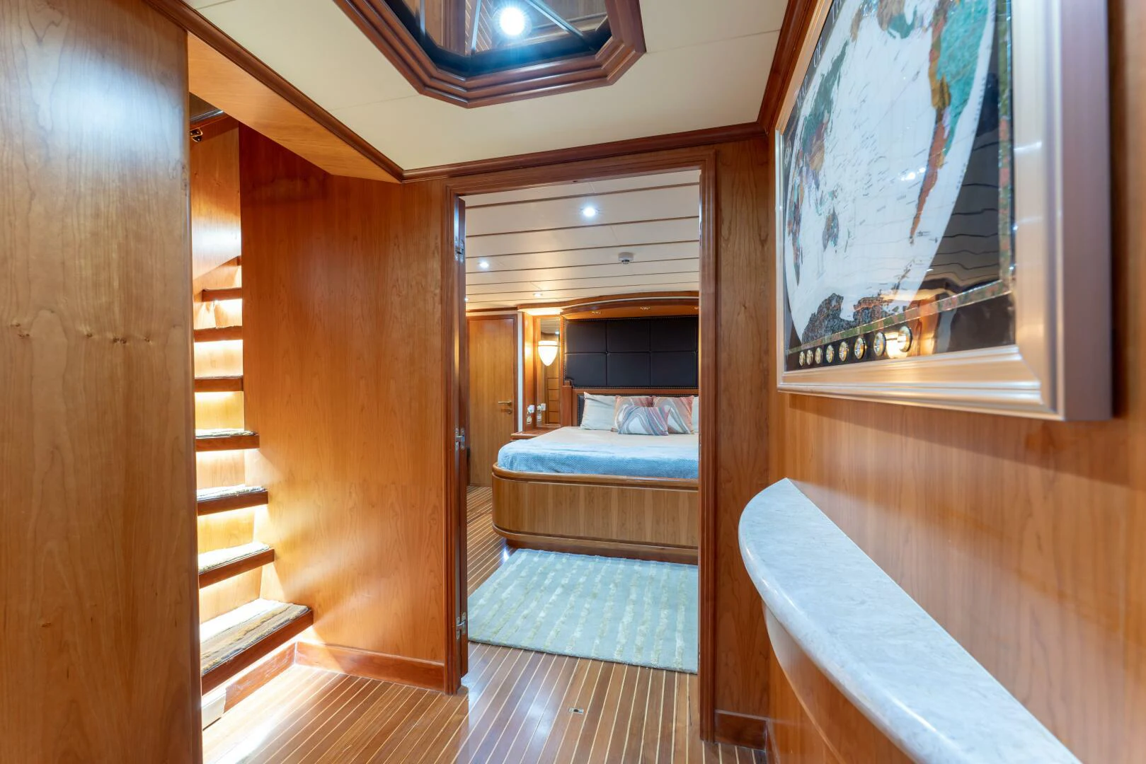 a room with a bed and a mirror aboard UN WINE Yacht for Sale