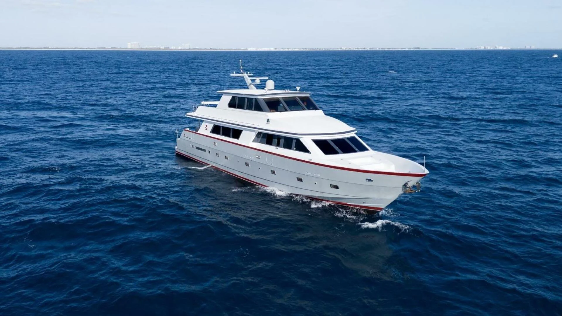 a white boat in the water aboard UN WINE Yacht for Sale