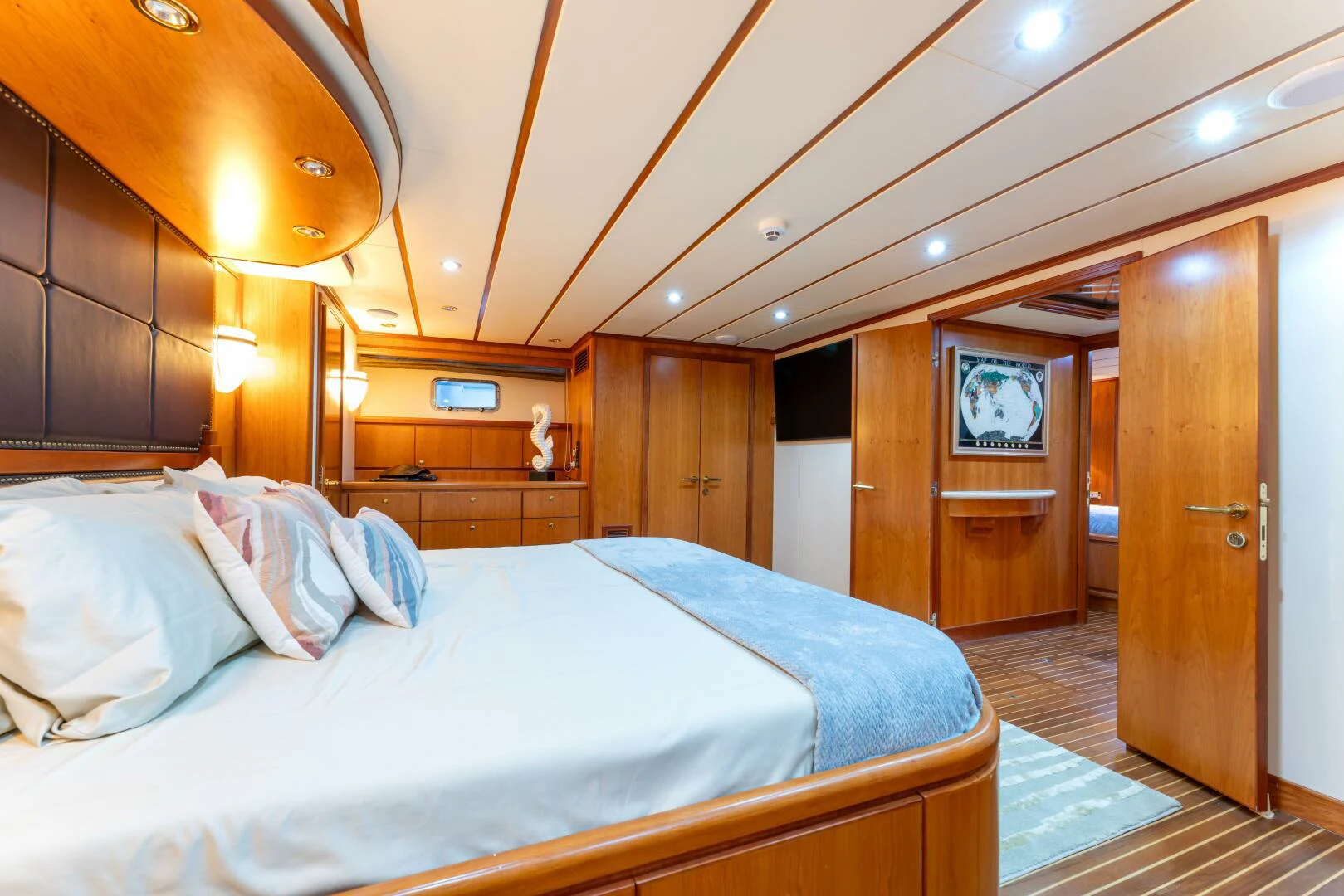 a large bed in a room aboard UN WINE Yacht for Sale