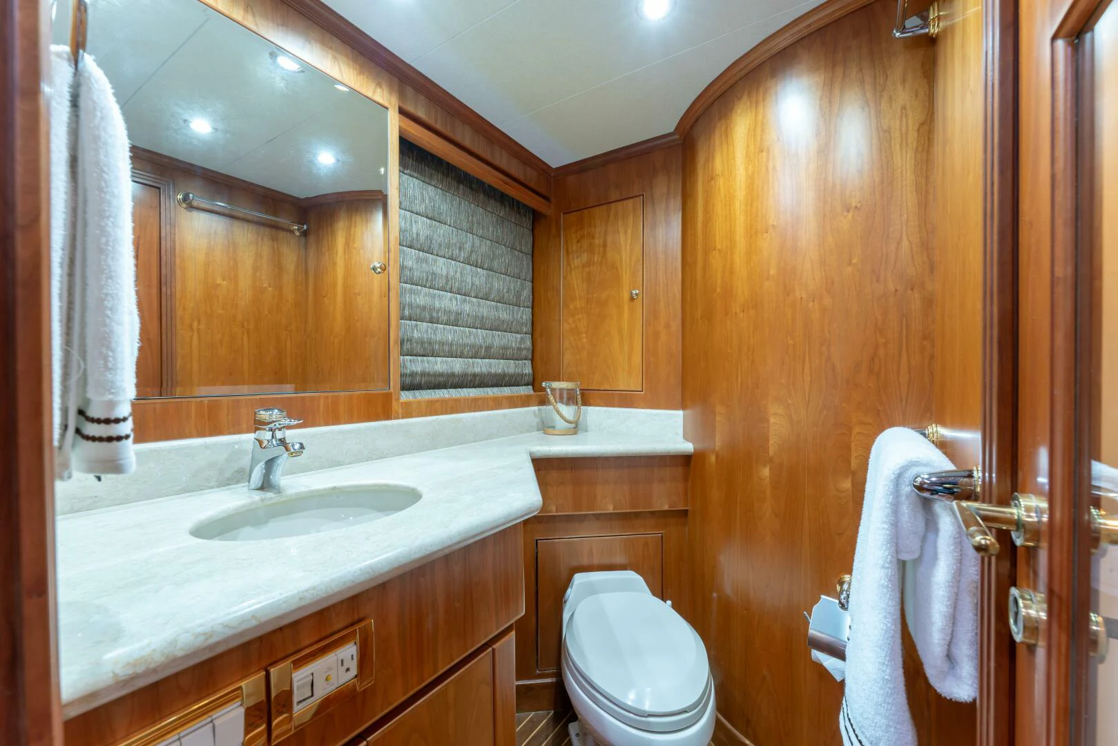 a bathroom with a toilet and a sink aboard UN WINE Yacht for Sale